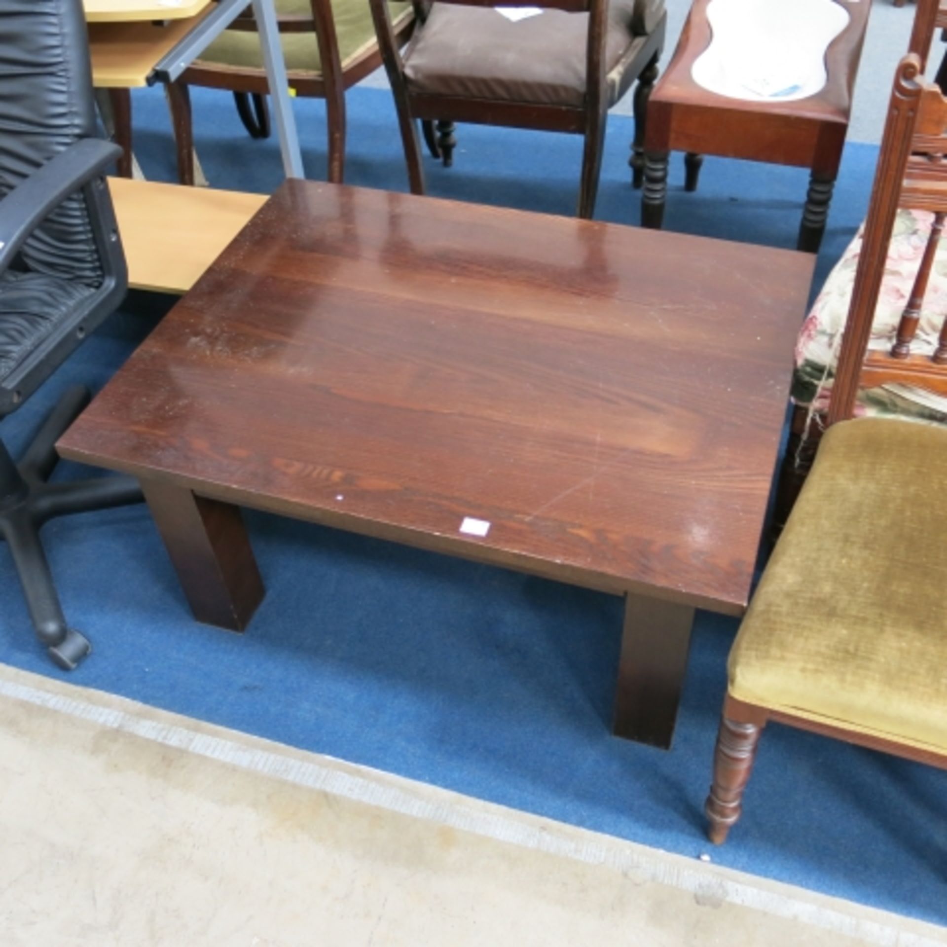 A stained wooden coffee table on square legs, W 90cm, D 70cm, H 45cm (est. £10-£20)