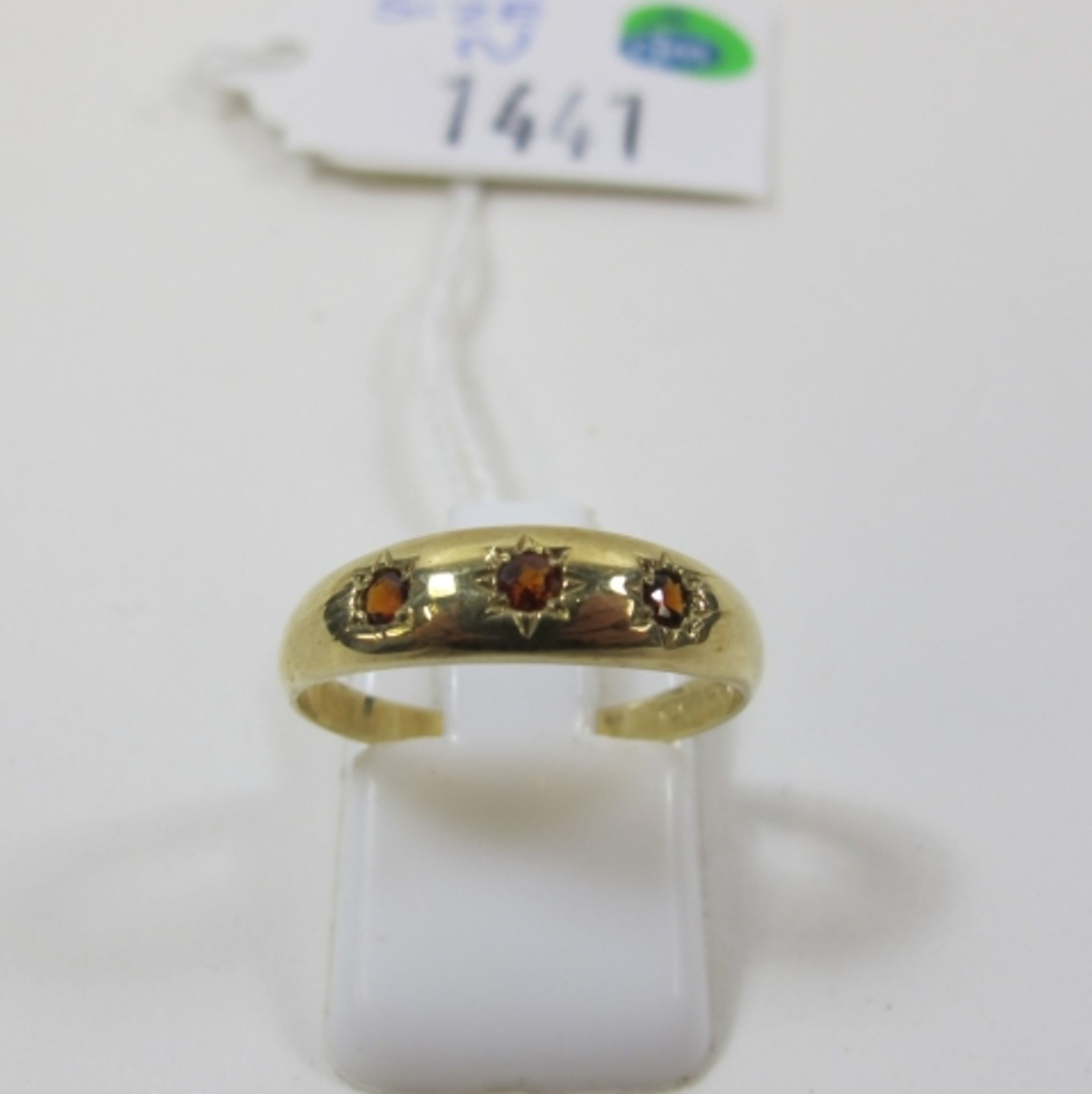 A 9ct Gold Three Stone Garnet Ring, Size N (est £20-£40)