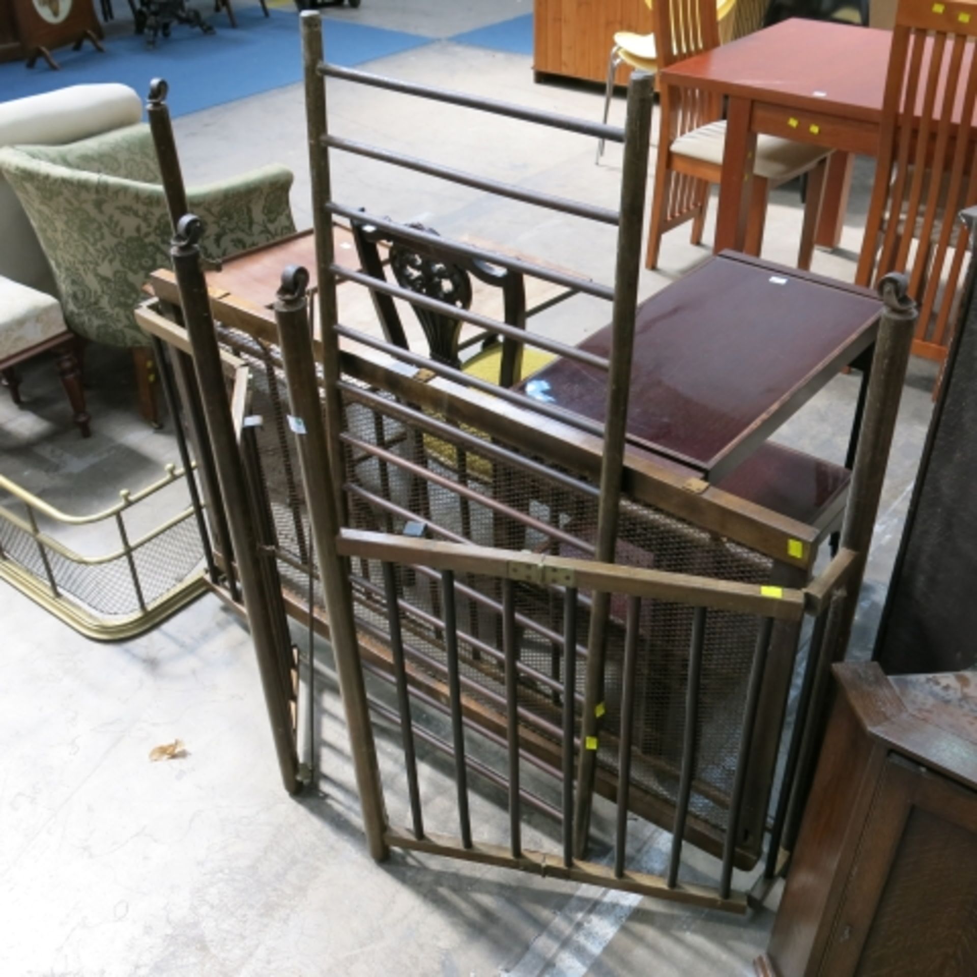 A vintage folding cot, a foldover trolley table, a mahogany square stool and a brass fire kerb/