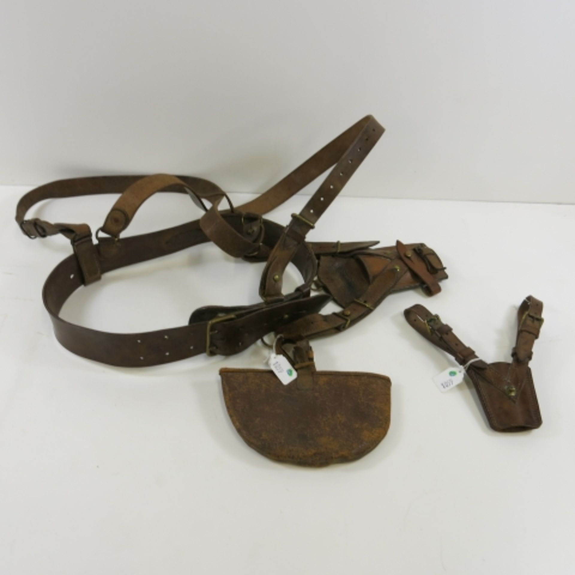 A leather belt gun holster with crossover shoulder straps and knife holder and pouch (est. £50-£70)