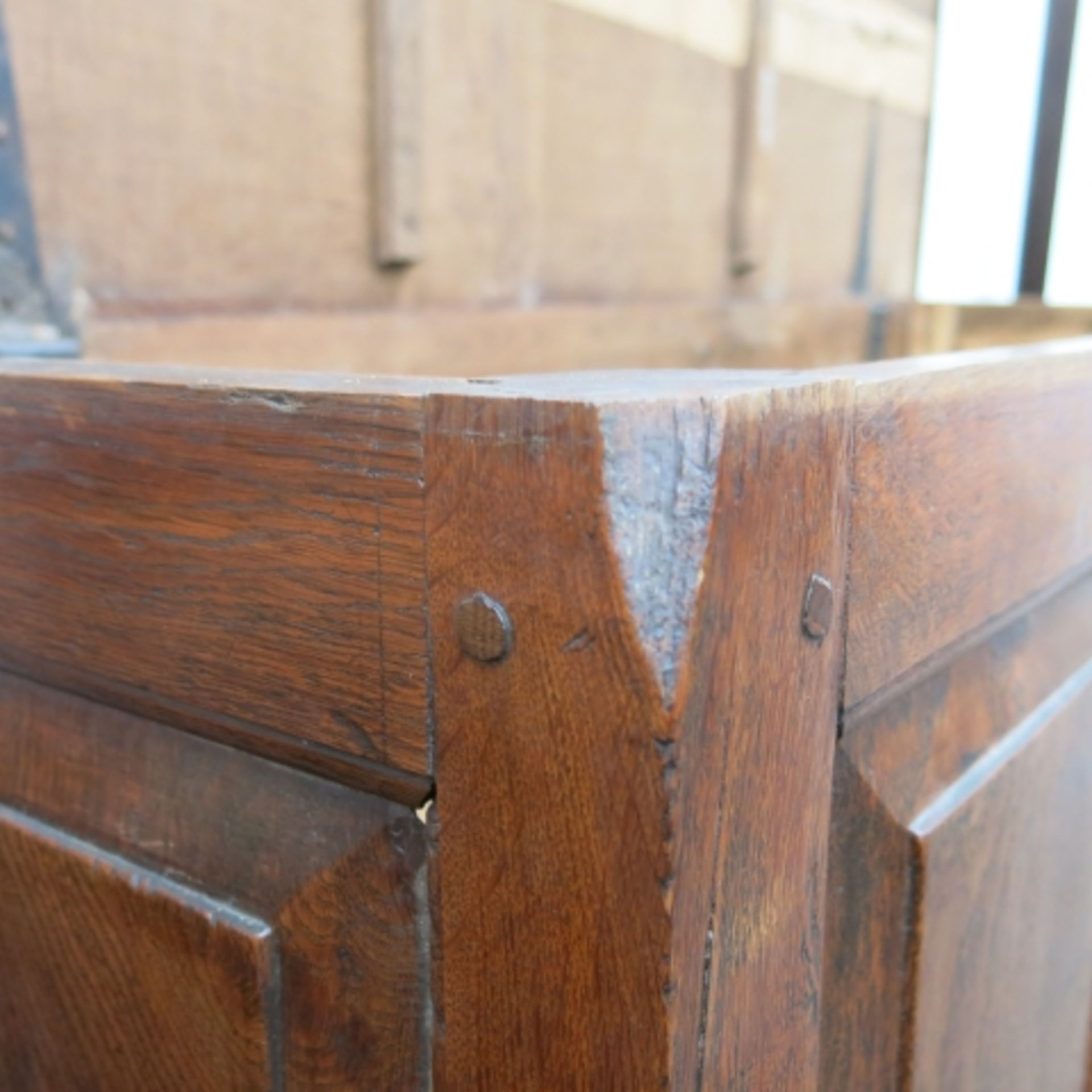 An 18th Century oak mule chest with plain top, panelled front, two drawers and bracket supports - Image 10 of 11