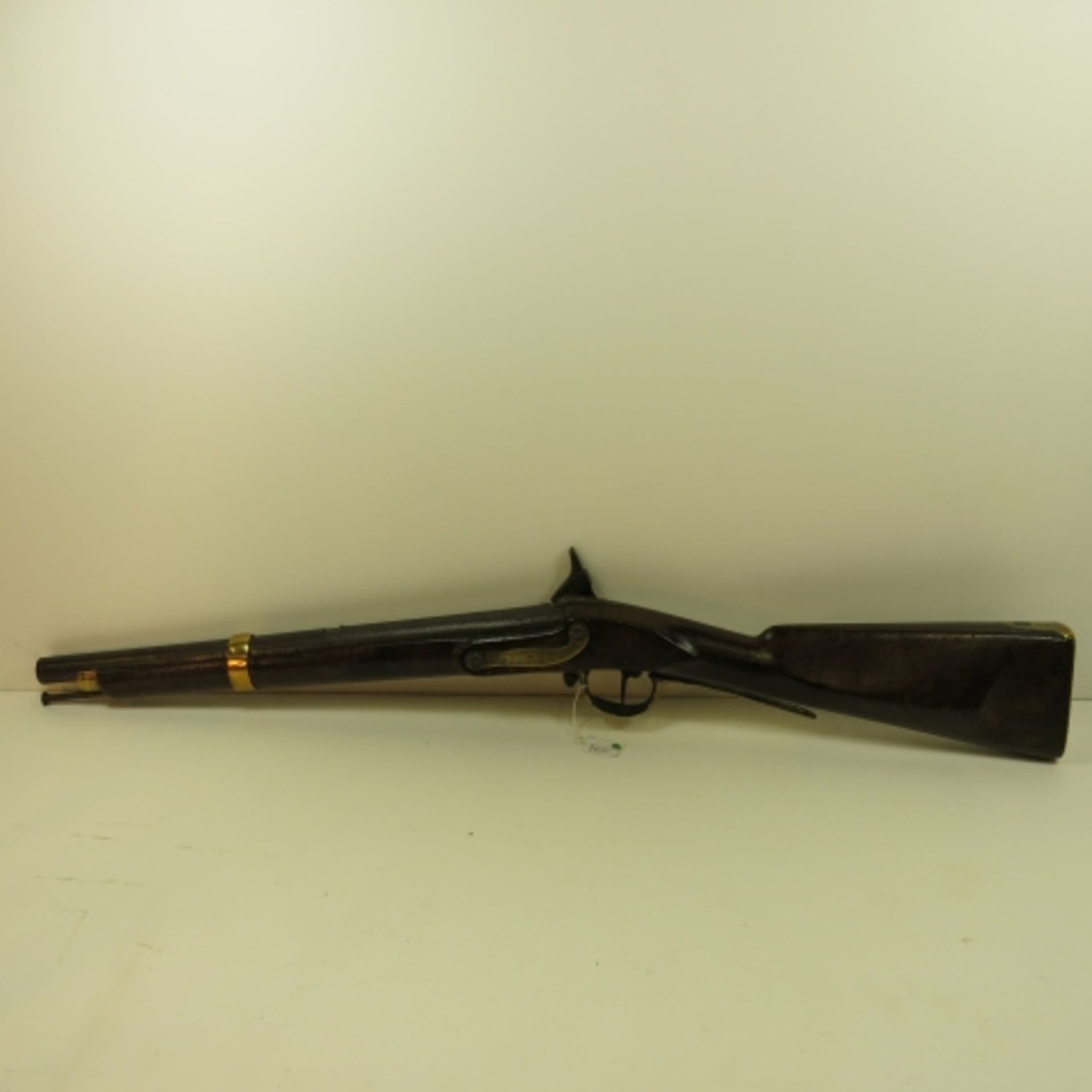 A Brown Bess Musket which has been converted to percussion. There are five brass mountings, two of