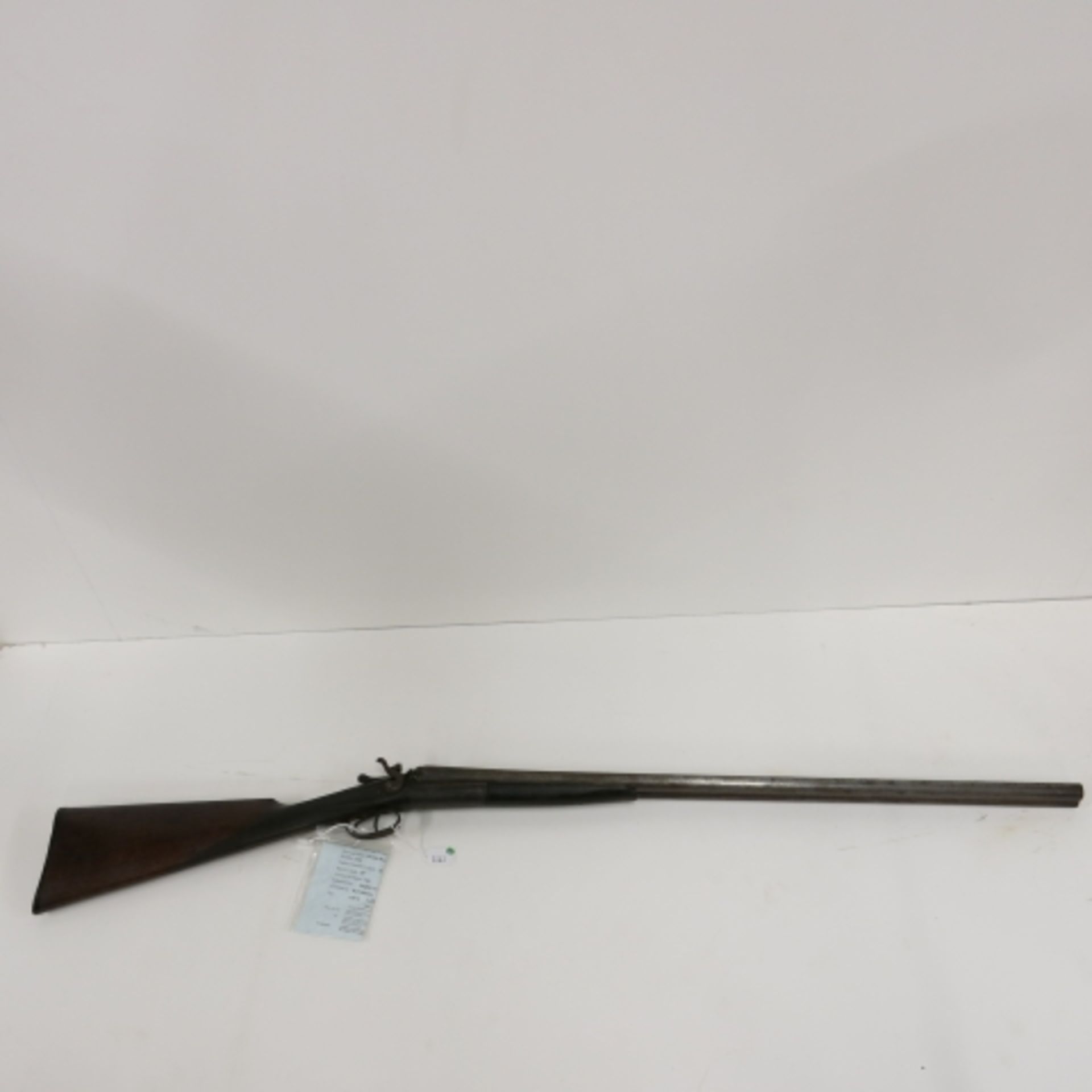 A 20 Bore Side By Side Shotgun By Beattie, Hammer Action. This Shotgun Has a Working Action and a