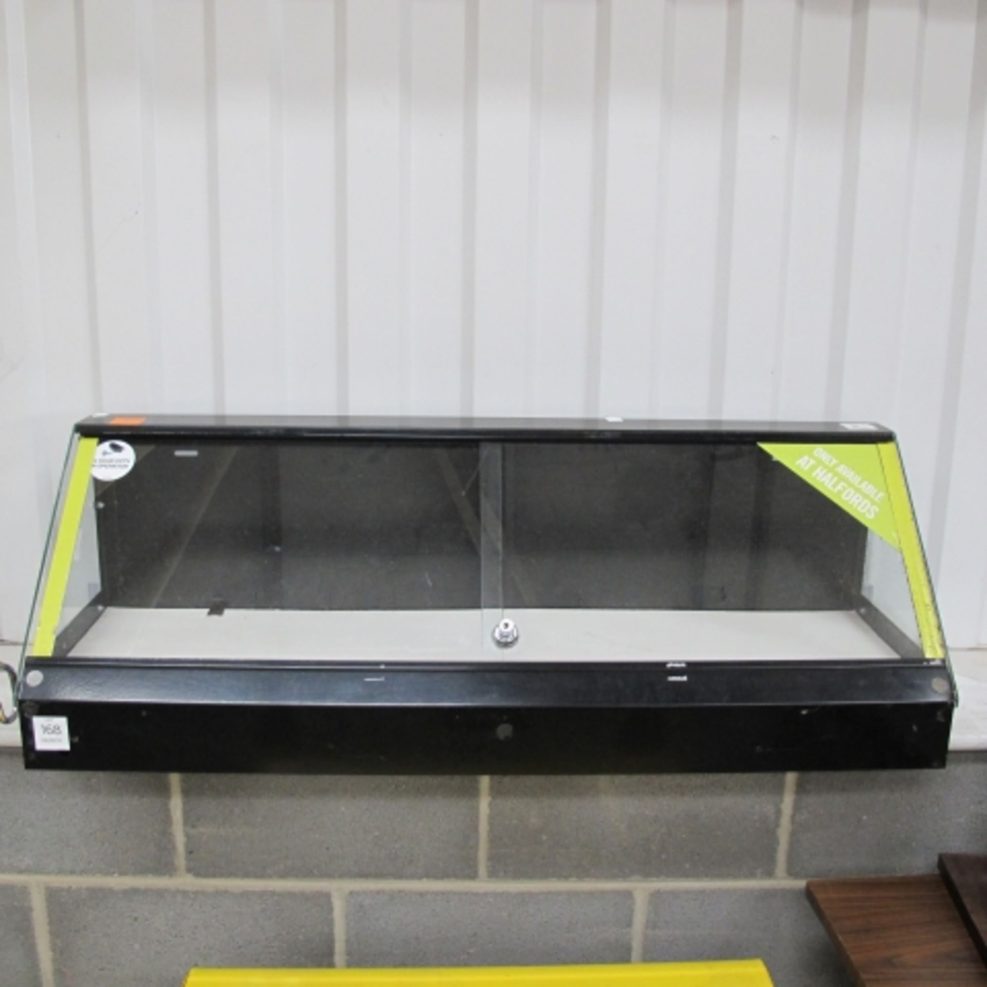 A Metal Shop Counter Display with 2 Sliding Doors.