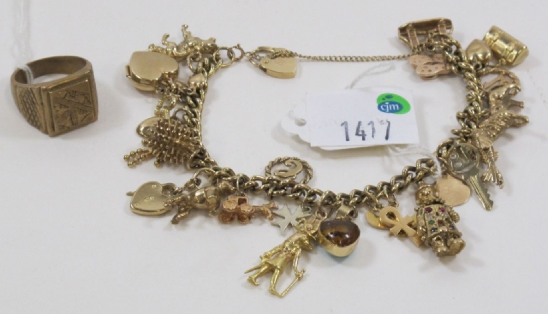 A Charm Bracelet With Over 20 Mixed Charms. One Of The Charms Is Stamped .375; Together With a Gents - Image 2 of 2