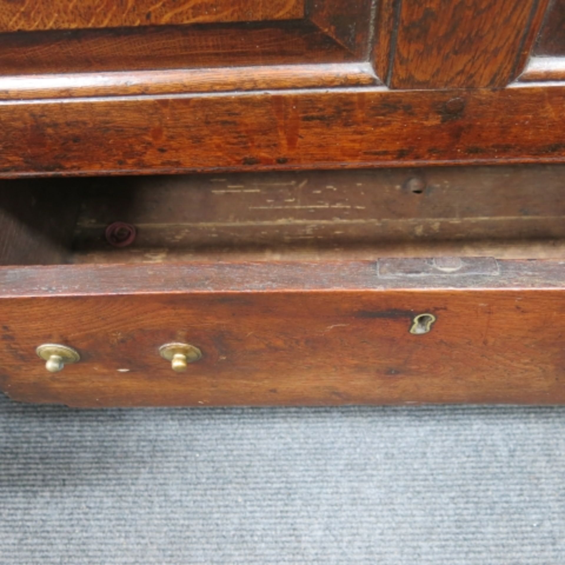 An 18th Century oak mule chest with plain top, panelled front, two drawers and bracket supports - Image 8 of 11