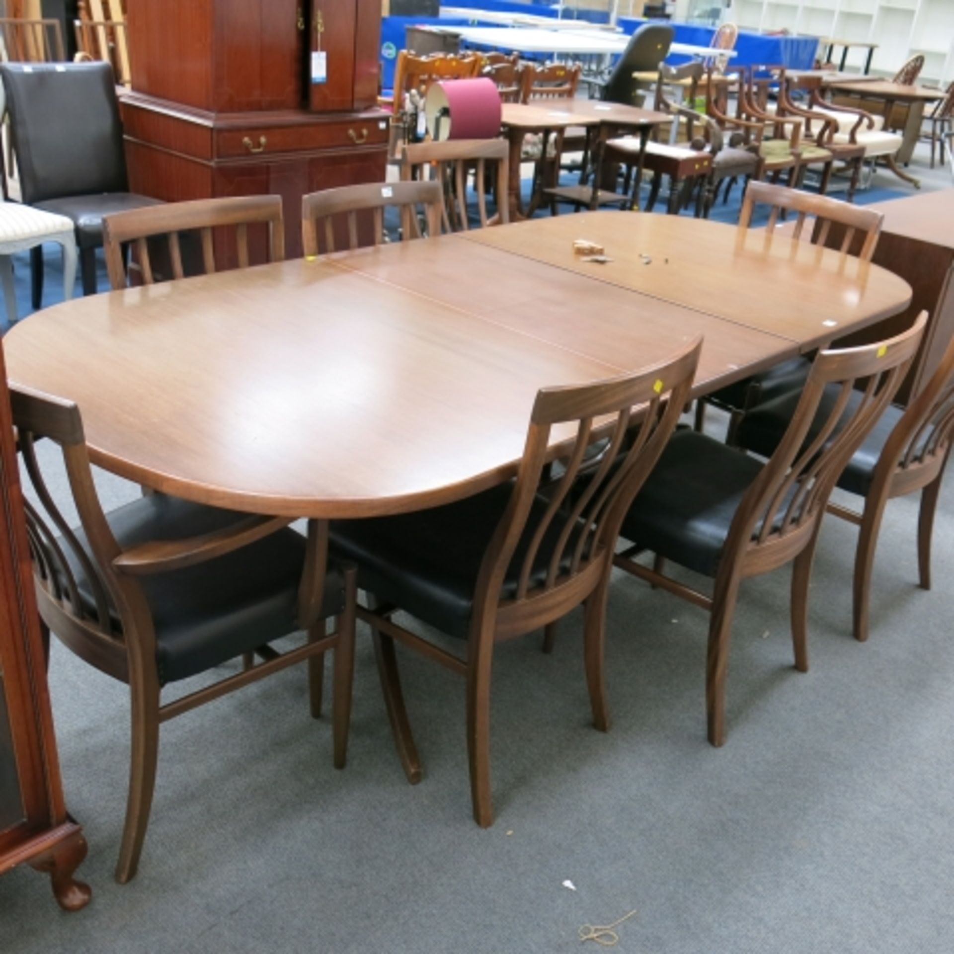 A 1960s walnut finish dining suite comprising pedestal table with inset folding leaf (240cm - Image 7 of 13