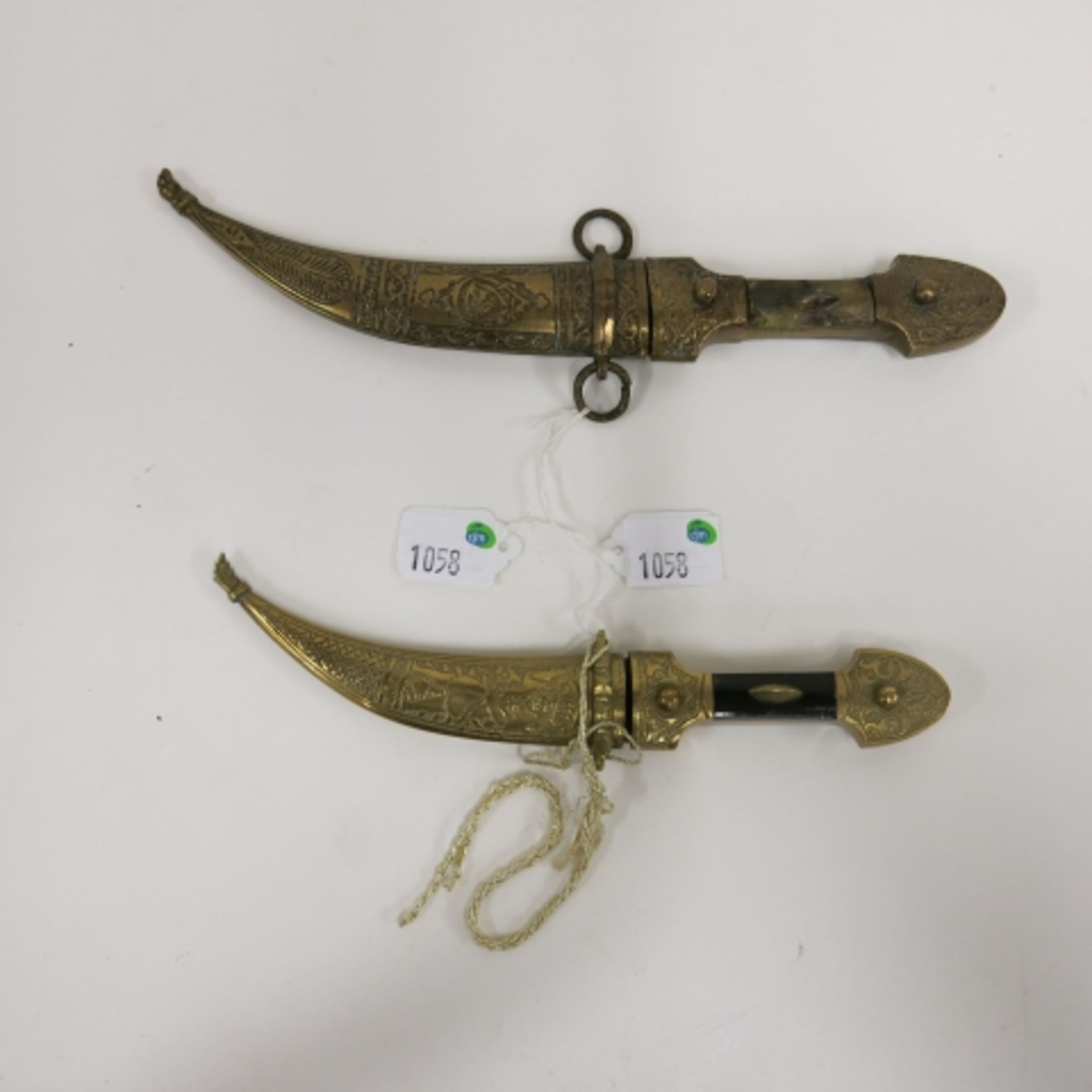 Middle Eastern style curved blade dagger knife with metal sheath together with another similar