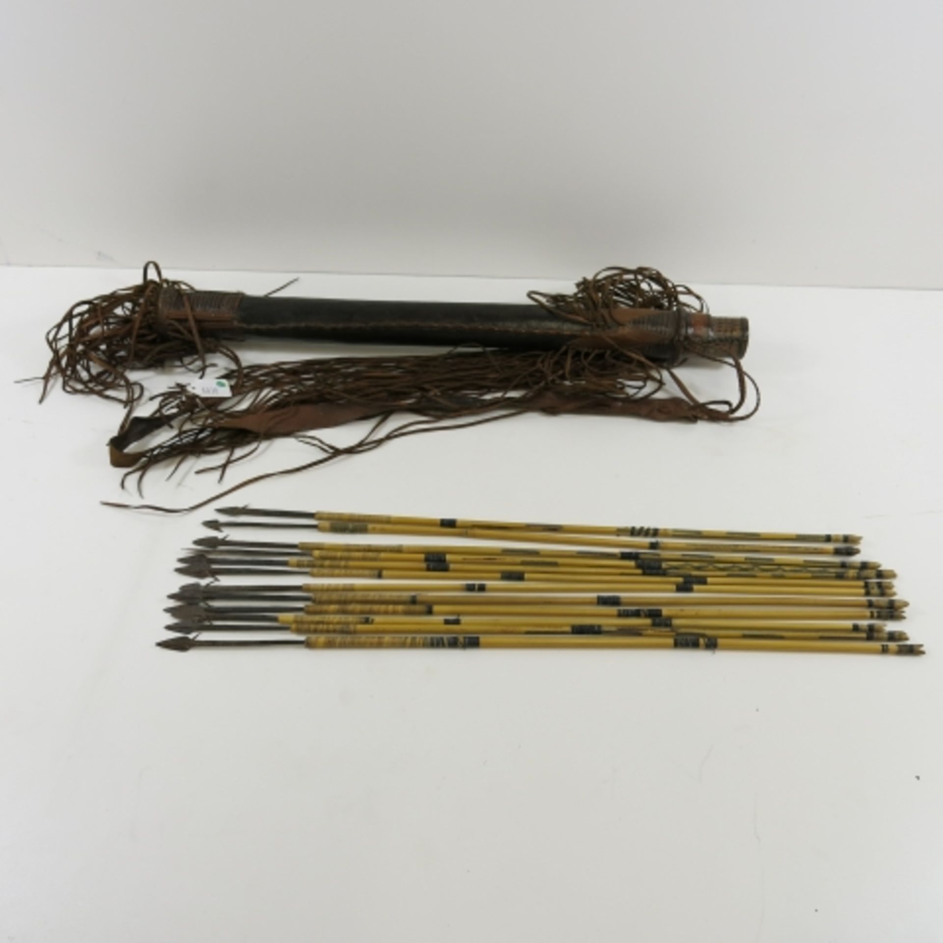 An antique African Quiver with twelve arrows. Typical arrow length 60cm (est. £40-£60)