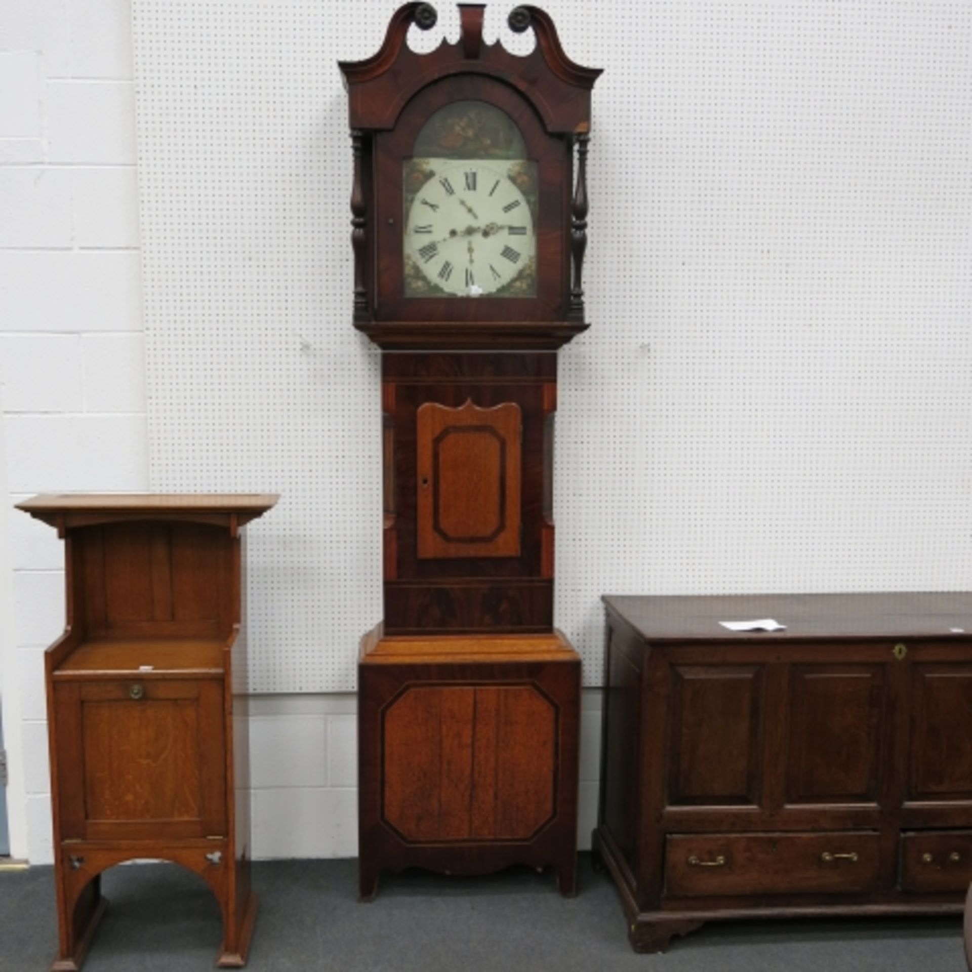 A large 19th century oak and mahogany longcase clock with unsigned painted dial and eight day