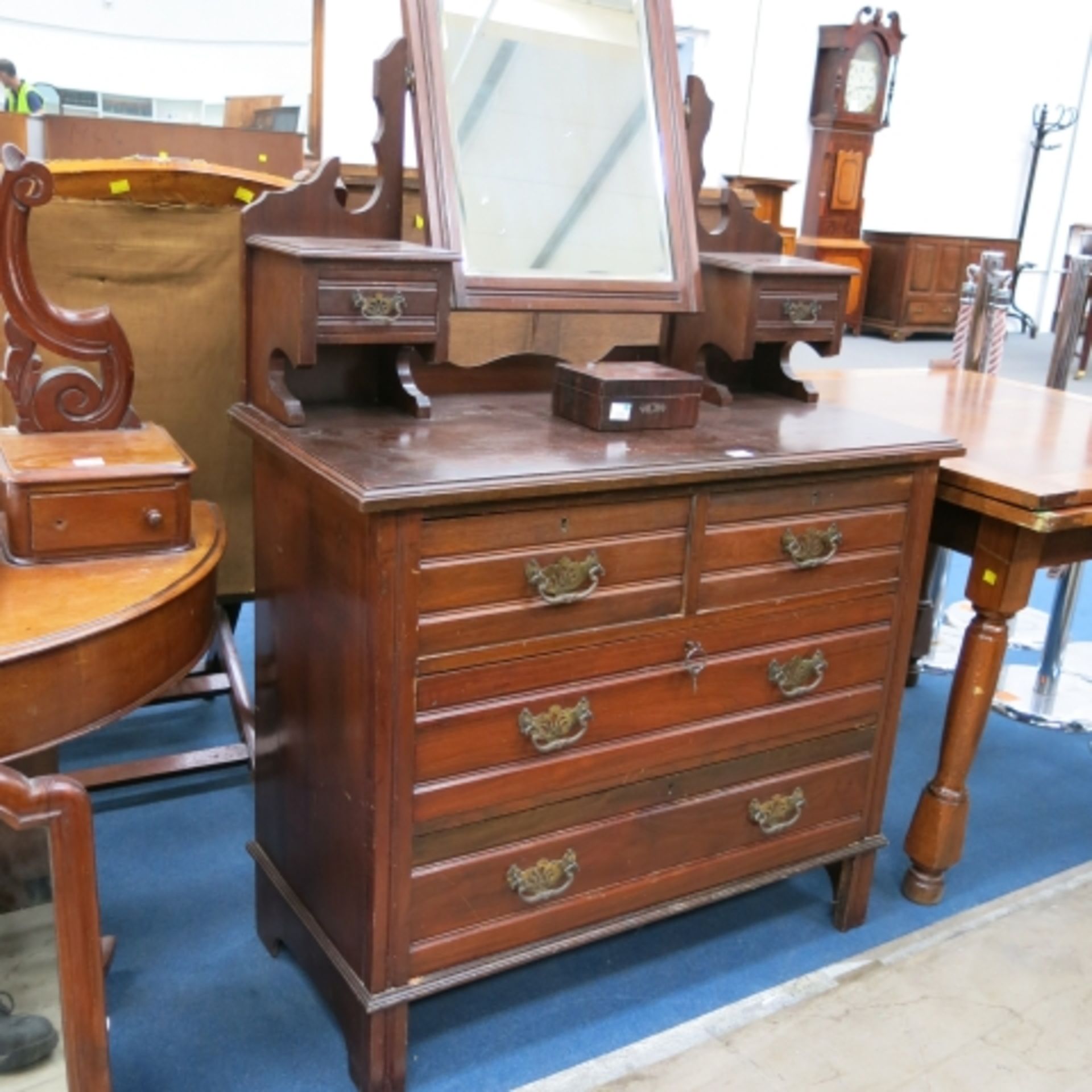 A mahogany dressing table comprising of 2 large drawers and 2 small drawers on the base unit and 2