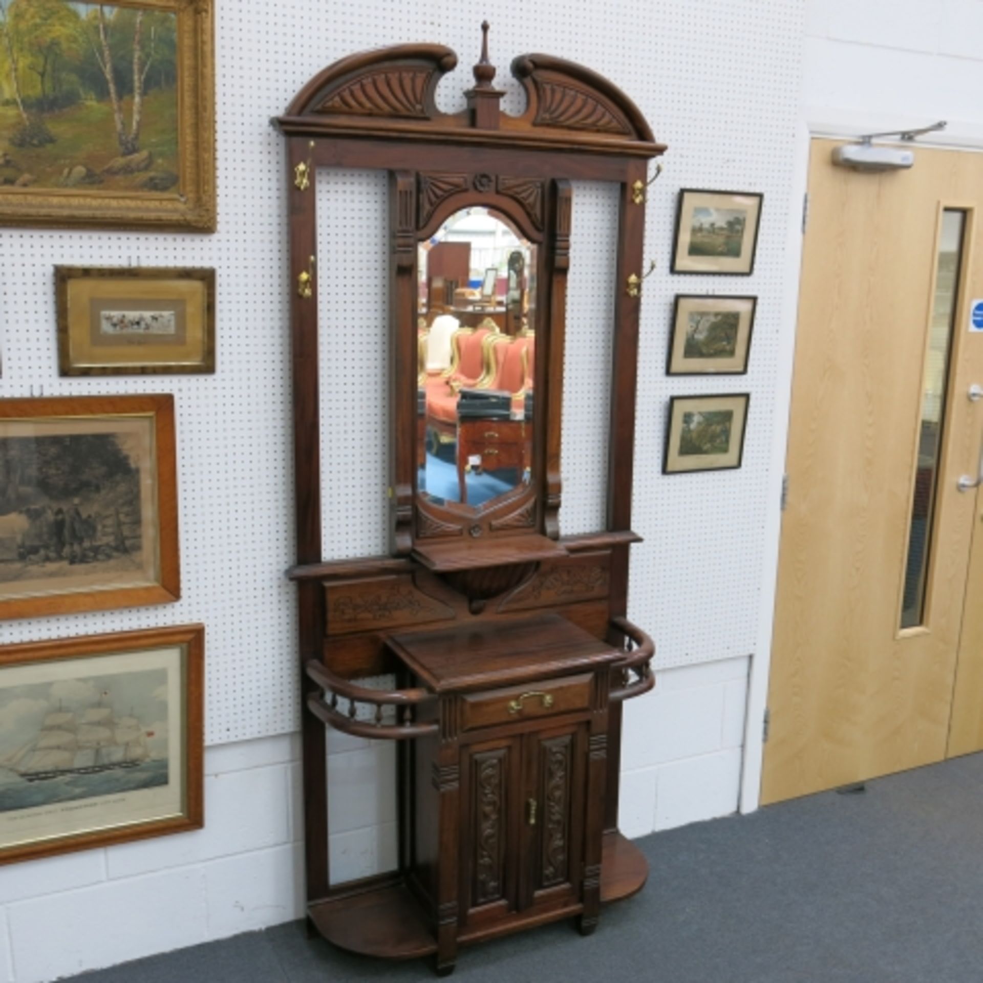 A late Victorian style hardwood back hall stand with drawer and cupboards. 214 cm high. (est. £50-£