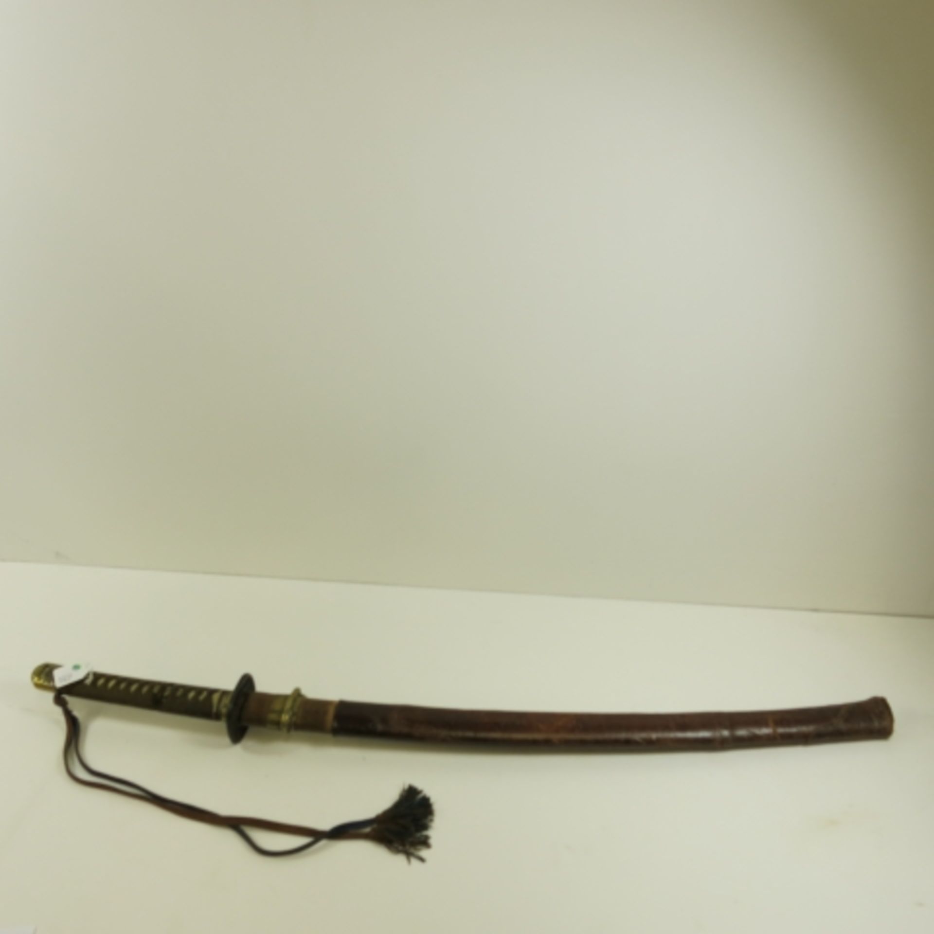 A Japanese Military Officer's Sword. The sword has fairly standard army mounts. The handle is