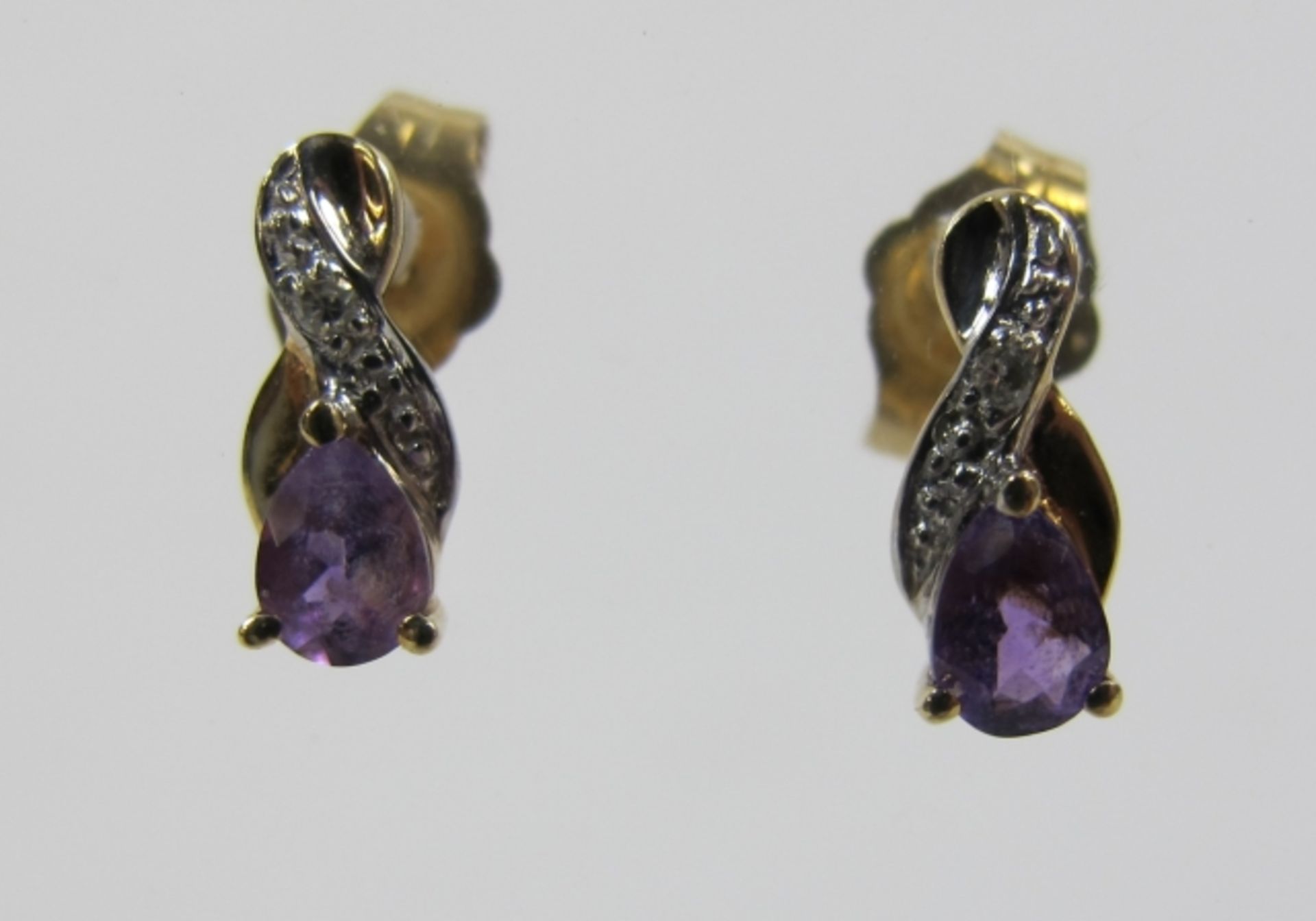 A Pair of 9ct Gold, Diamond and Amethyst Earrings (est £20-£40)