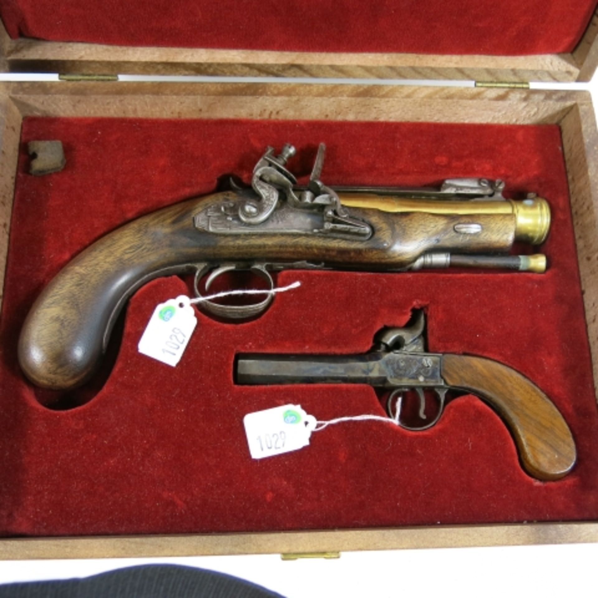 A walnut handled percussion lead ball type Pocket Pistol with a 1cm bore, with a brass barrelled