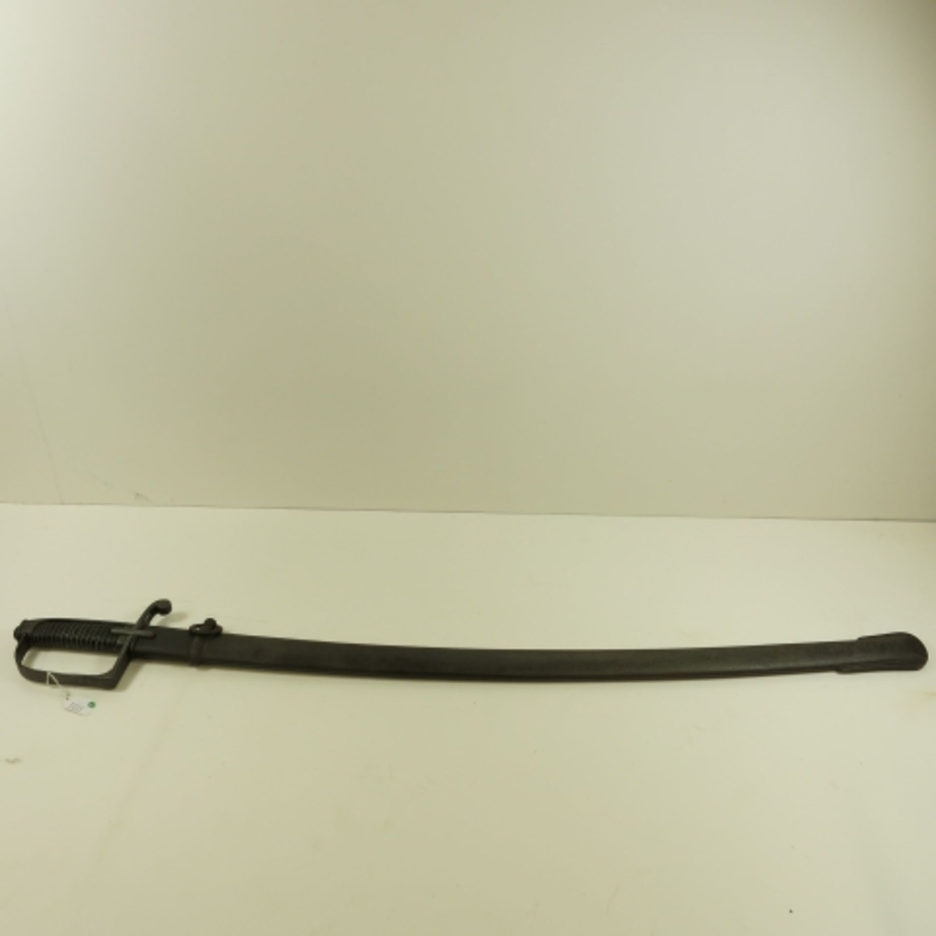 An Australian Hussar Sabre heavy Cavalry Sword. It has a leather and brass bound handle and steel