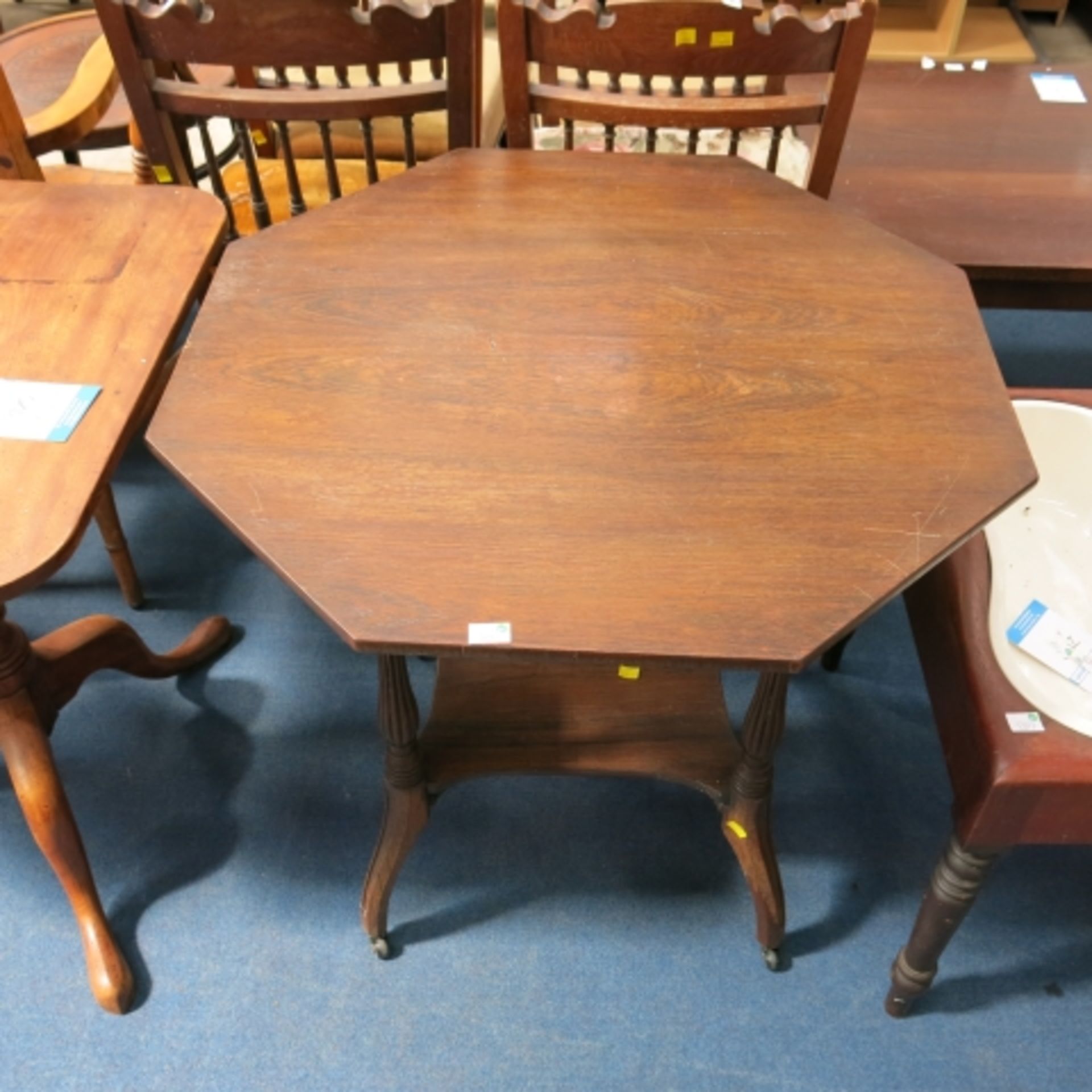 Octagonal Rosewood Window Table raised on Four Turned and Reeded Supports united by an Under tier