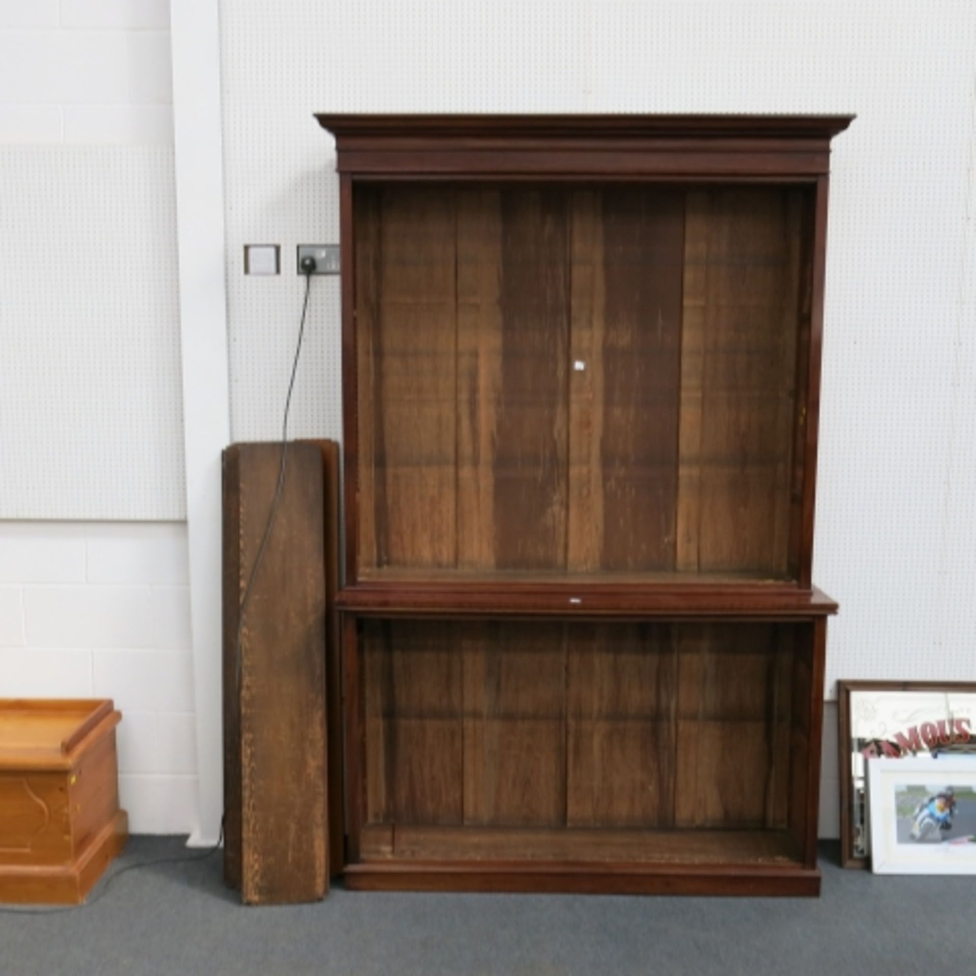 A large 19th century mahogany open bookcase with shaped pediment and adjustable shelves to the top