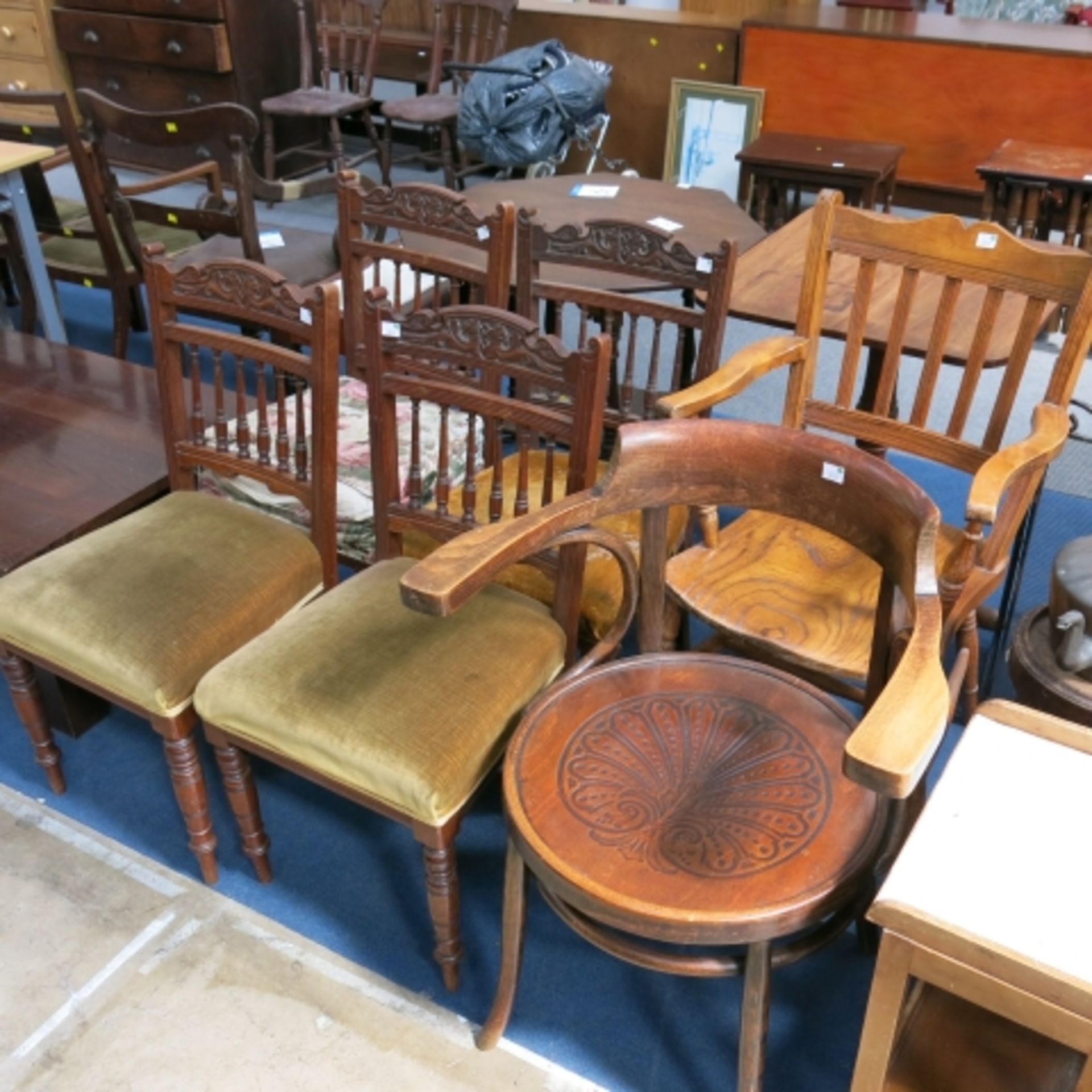 4 x Matching wooden framed chairs with turned spindle back and front legs featuring carved