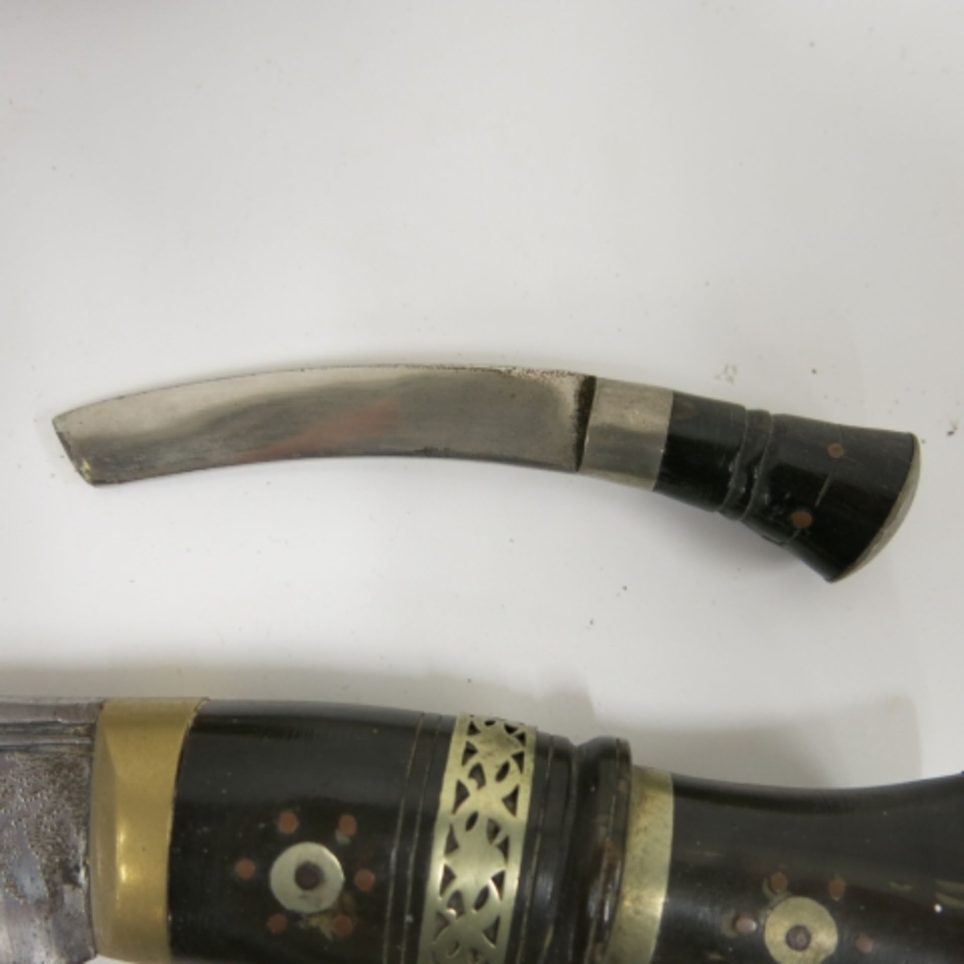 A Kukri knife with sheath and two accessory knives. Blade length 29cm (est. £50-£80) - Image 4 of 5