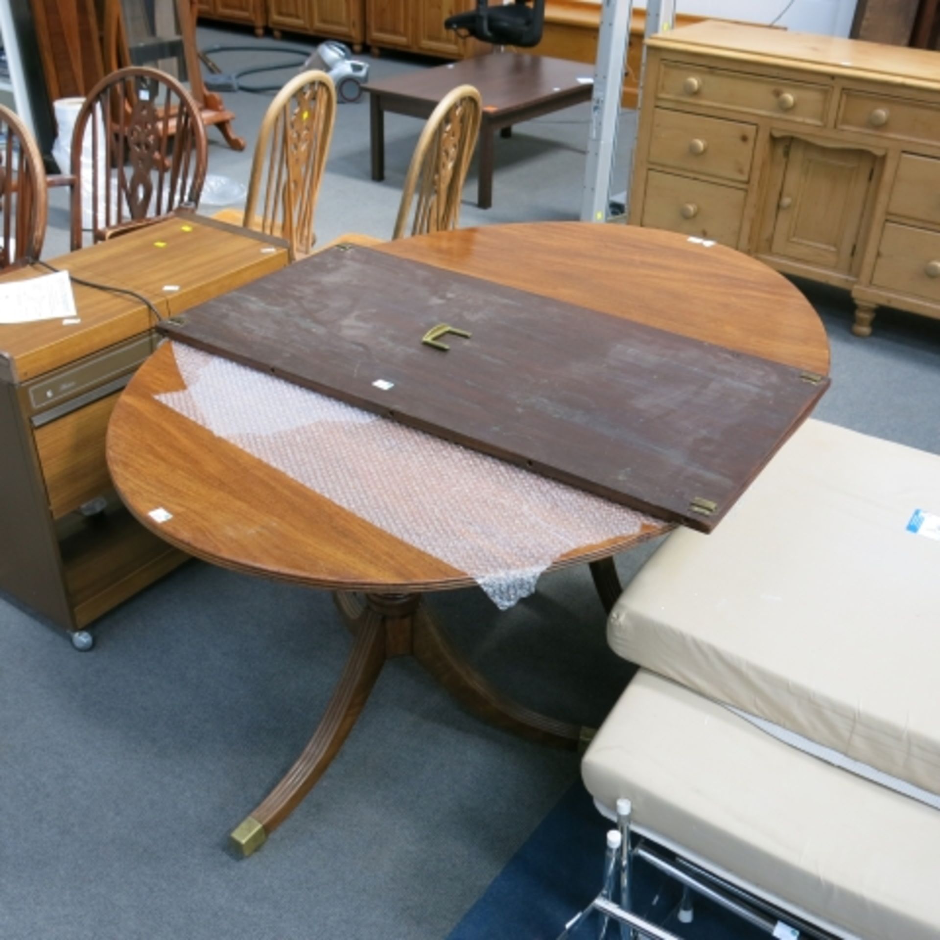 A Regency design mahogany double pedestal D-end dining table with spare leaf 206 cm extended (