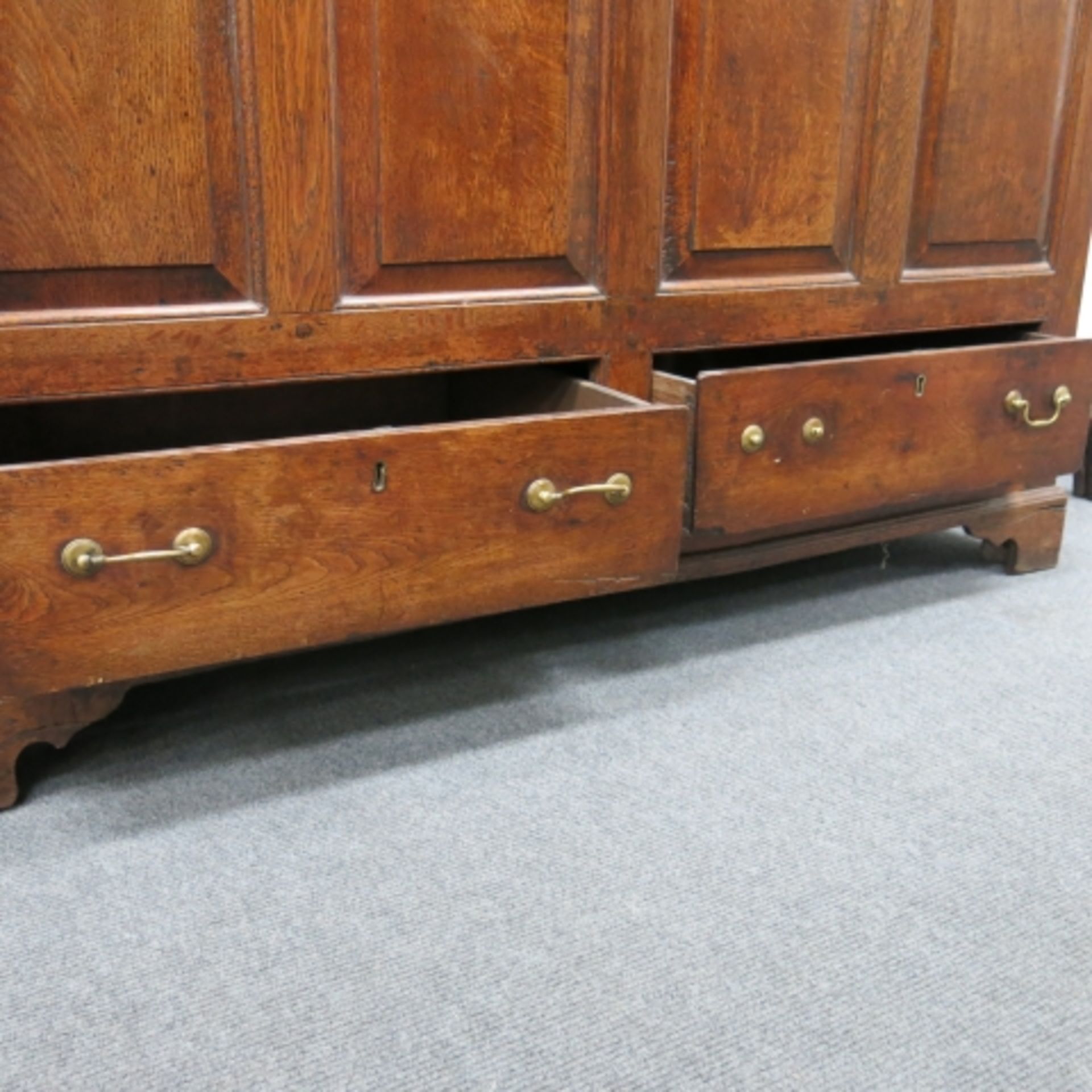 An 18th Century oak mule chest with plain top, panelled front, two drawers and bracket supports - Image 6 of 11