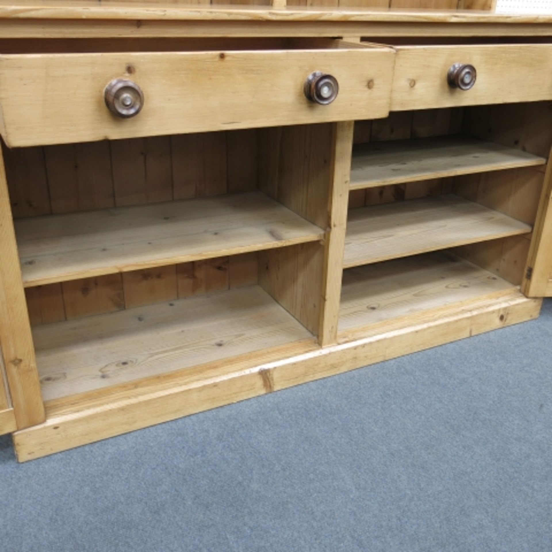 A Victorian stripped and polished pine 'Welsh' dresser with large delft rack over cupboards and - Image 4 of 9