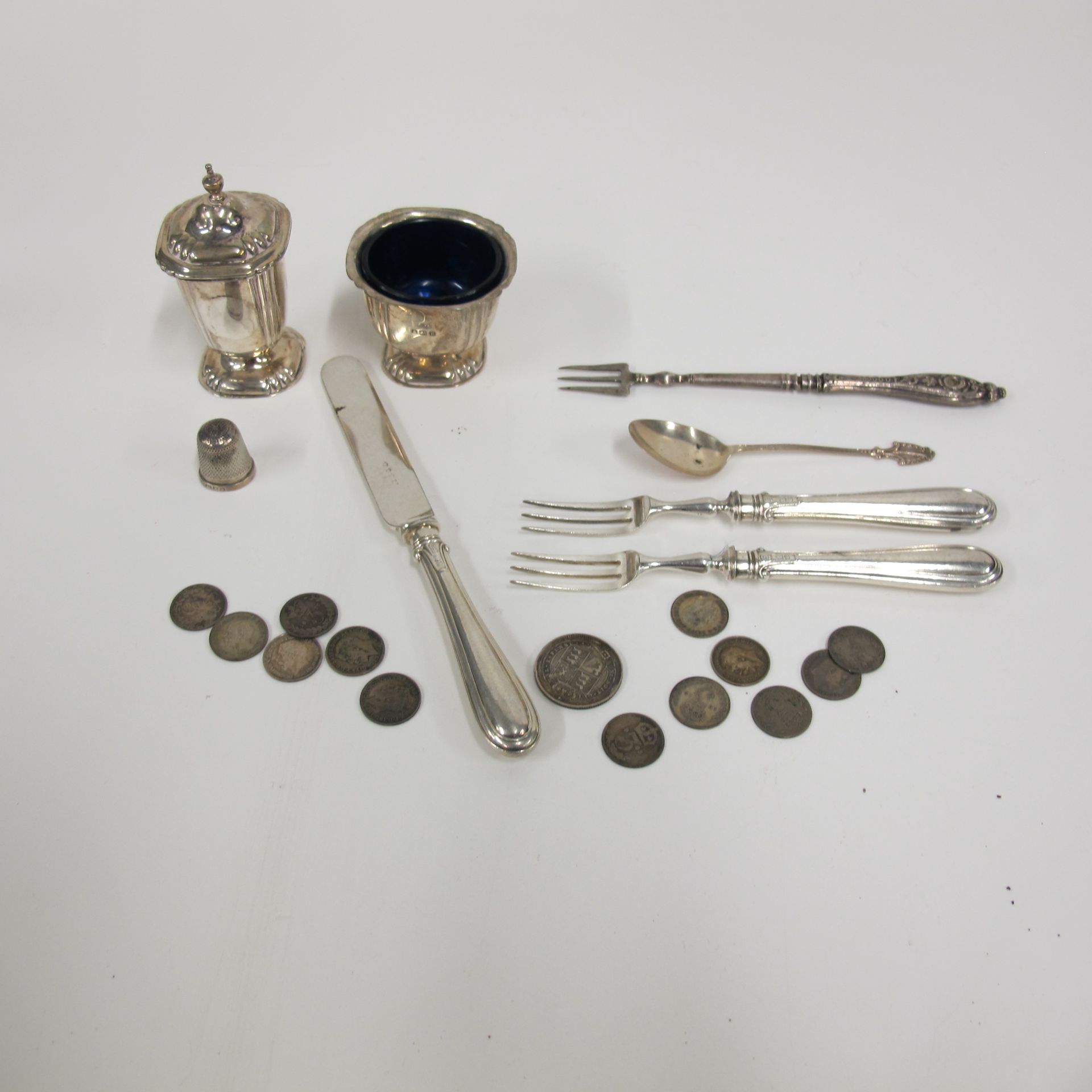 A Silver Pedestal Pepperette and Salt. Birmingham 1941; Two Silver Handled Forks and a Knife; a