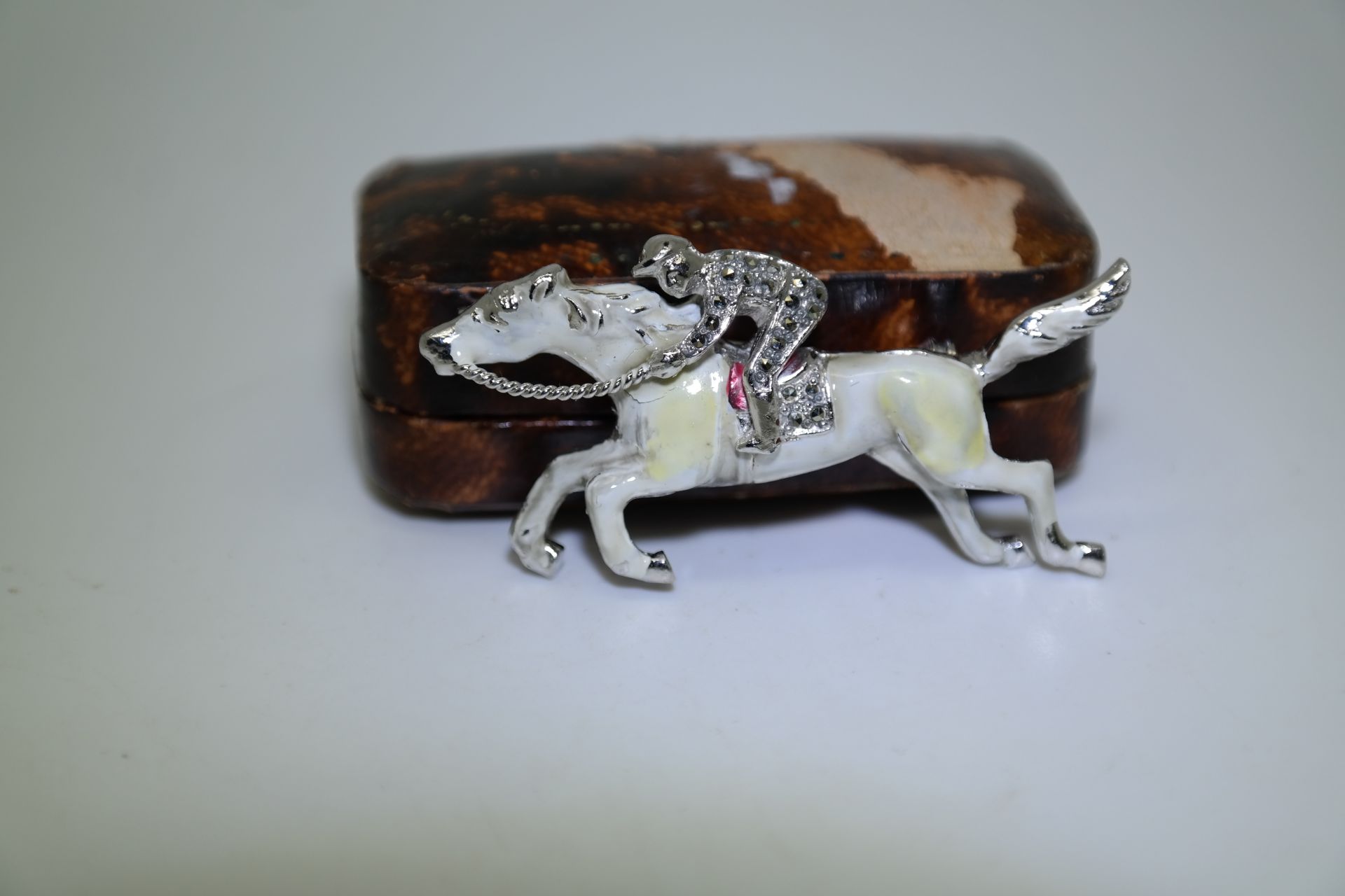 JOCKEY HORSE RACING ENAMEL BROOCH