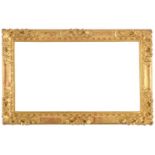 A 17th/18th Louis XIV frame,
carved and gilded, plain sight, ovolo top edge with flowers and leaf