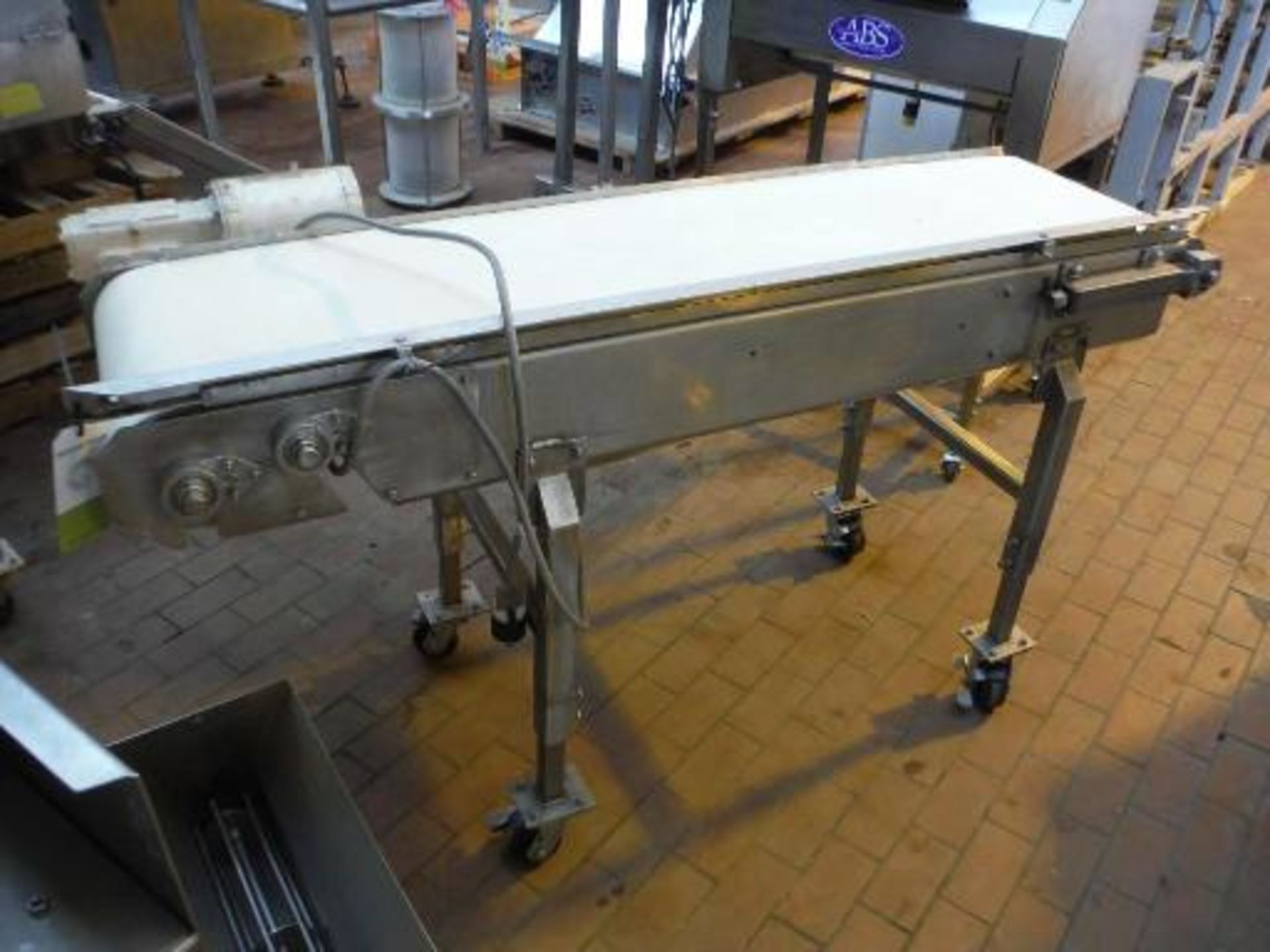 Transfer conveyor, 70 in. long x 18 in. wide x 39 in. tall, 1/2 hp drive, SS frame, casters ***___
