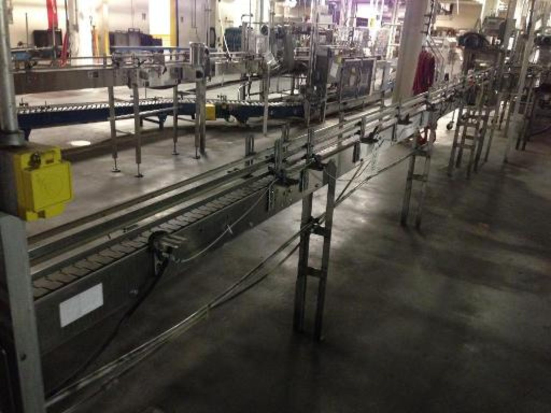 Arrowhead SS bottle conveyor, 3 1/4 inch table top chain approx. 30 feet long with motor and
