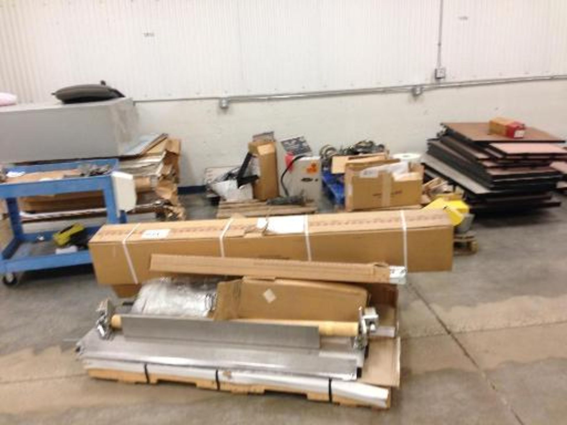(8) pallets and a cart conveyer parts, heater parts, diaphragm pump parts (LOT) This item located in