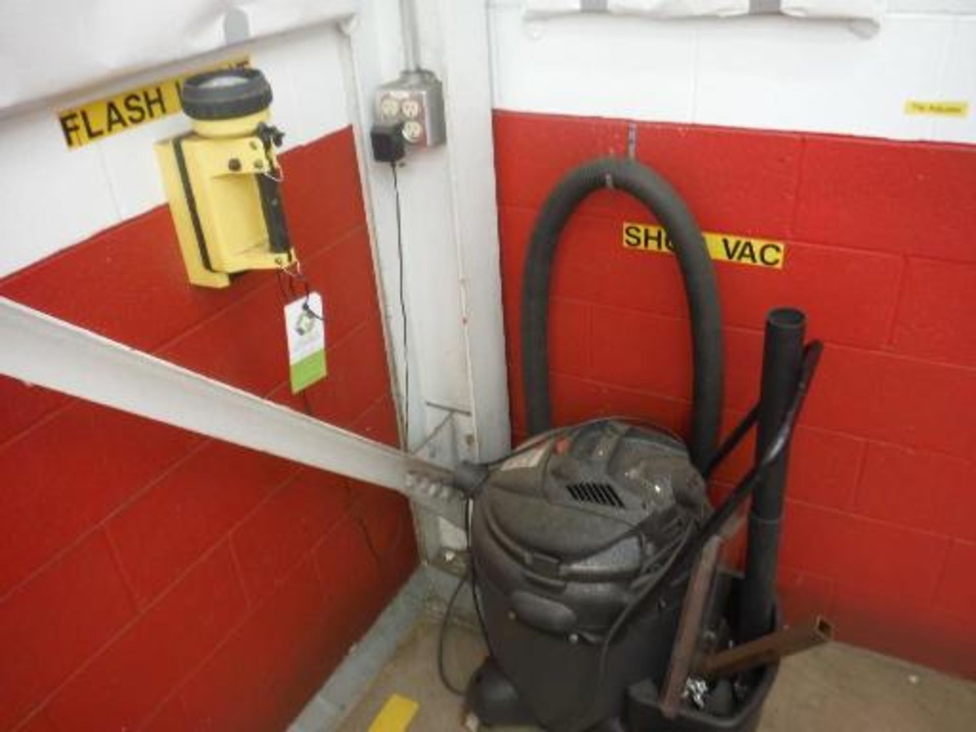 Shop Vac, wall mount rechargeable flashlight, 18 in diameter hose reel. Located in Marion, Ohio