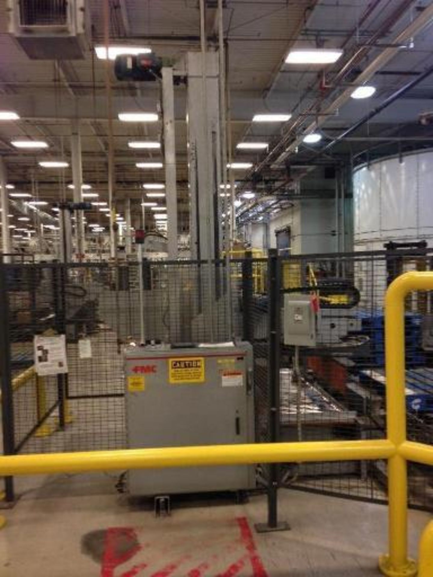 FMC palletizer-stacker with pallet loader, slip sheet attachment. Located in Marion, Ohio Rigging