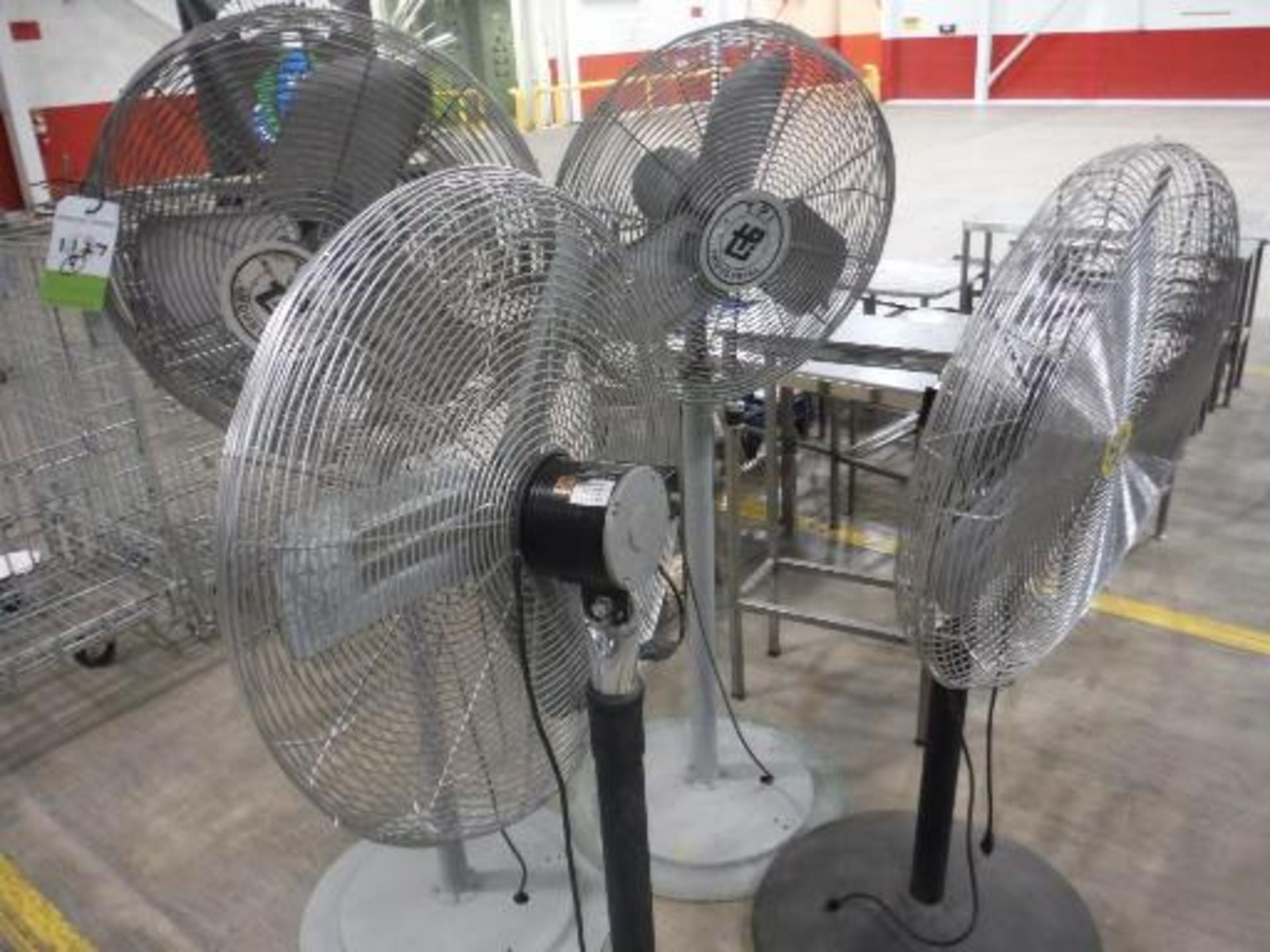 (4) Industrial standing fans (EACH). Located in Marion, Ohio Rigging Fee: $100