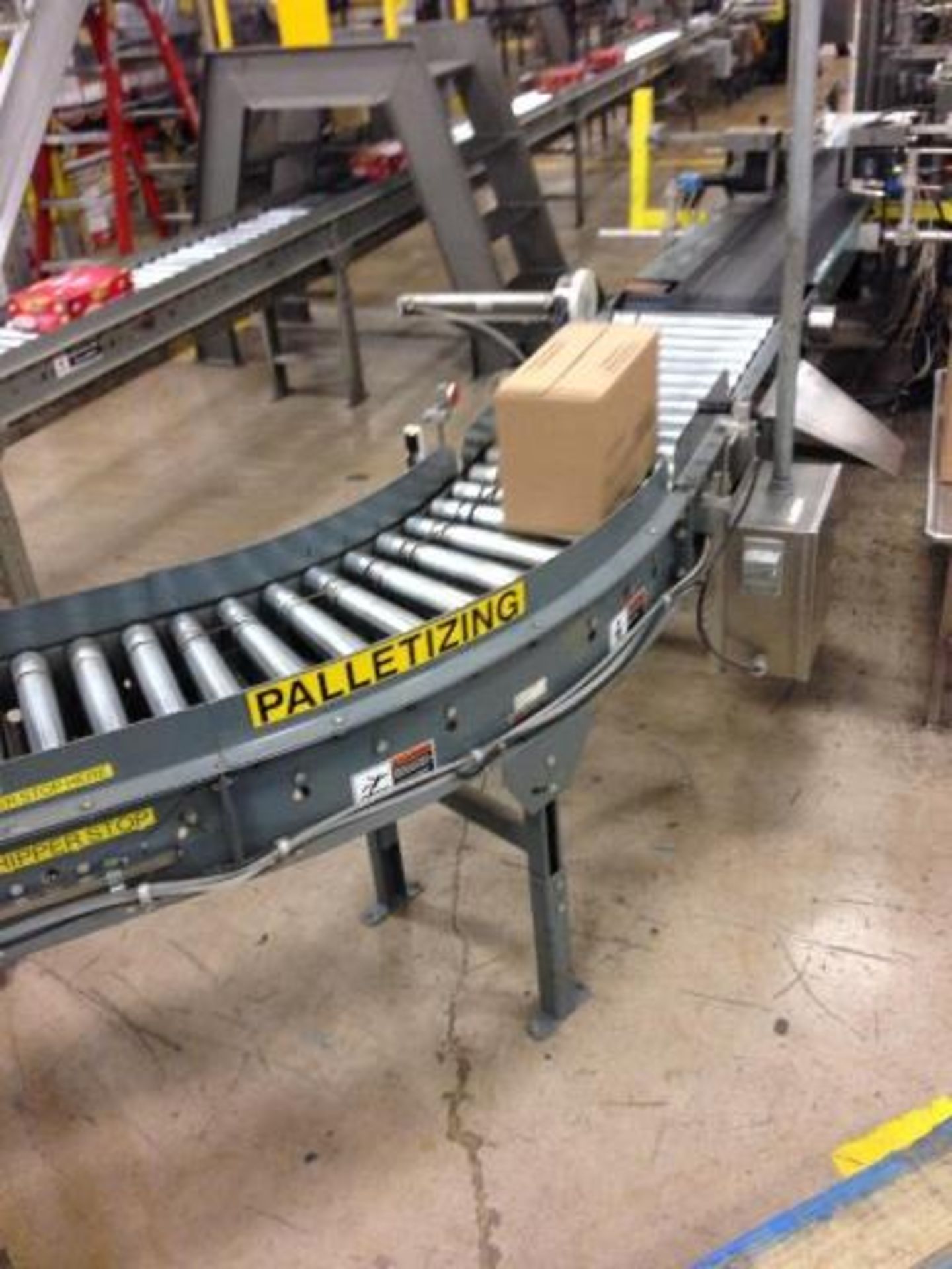 Full case conveyor 40 feet long to palletized (line 13) right to left stand alone line. Located in - Image 2 of 6