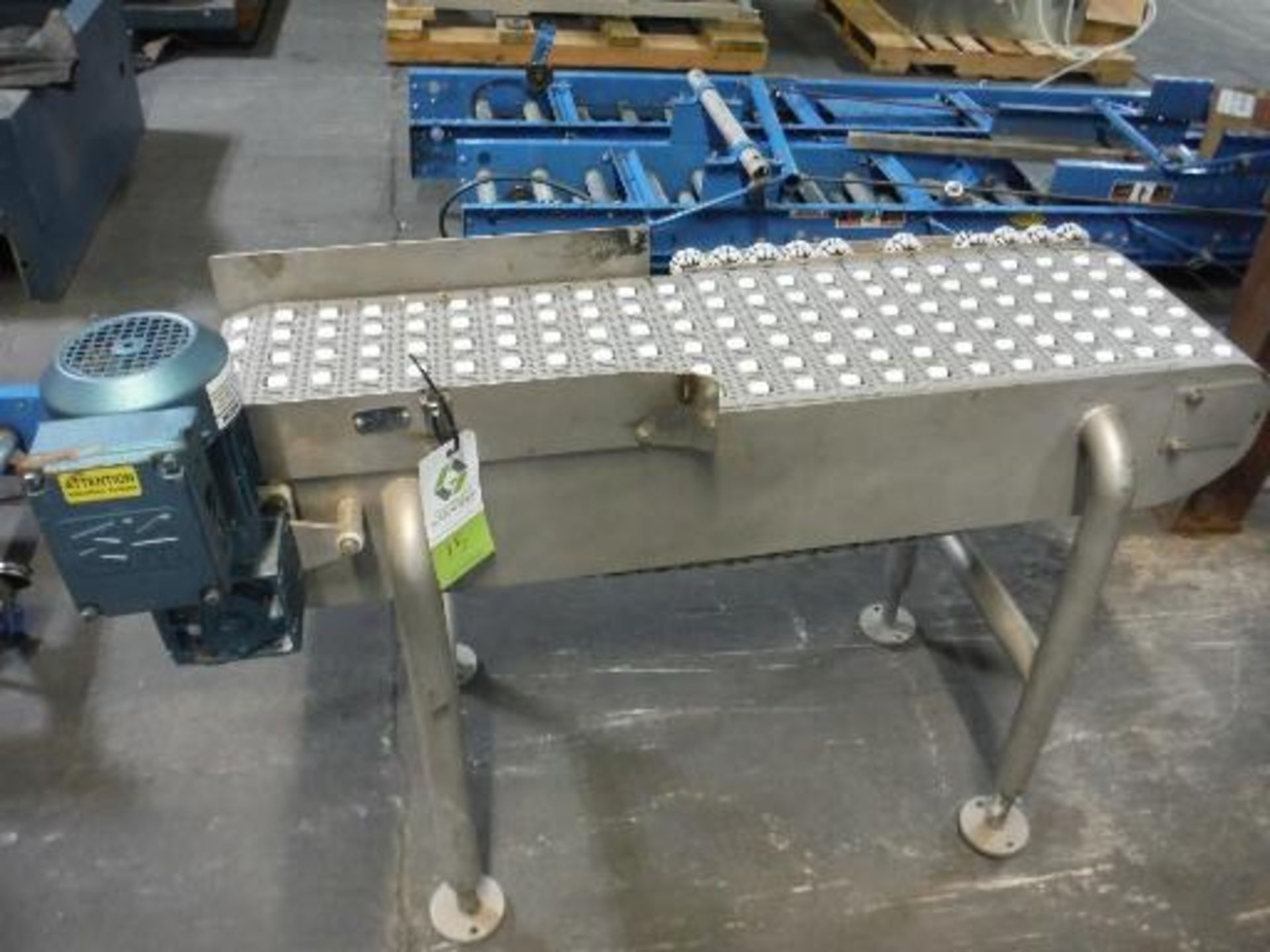 Powered conveyor, plastic interlock belt with free rolling side rollers, 48 in. long x 12 in. wide x