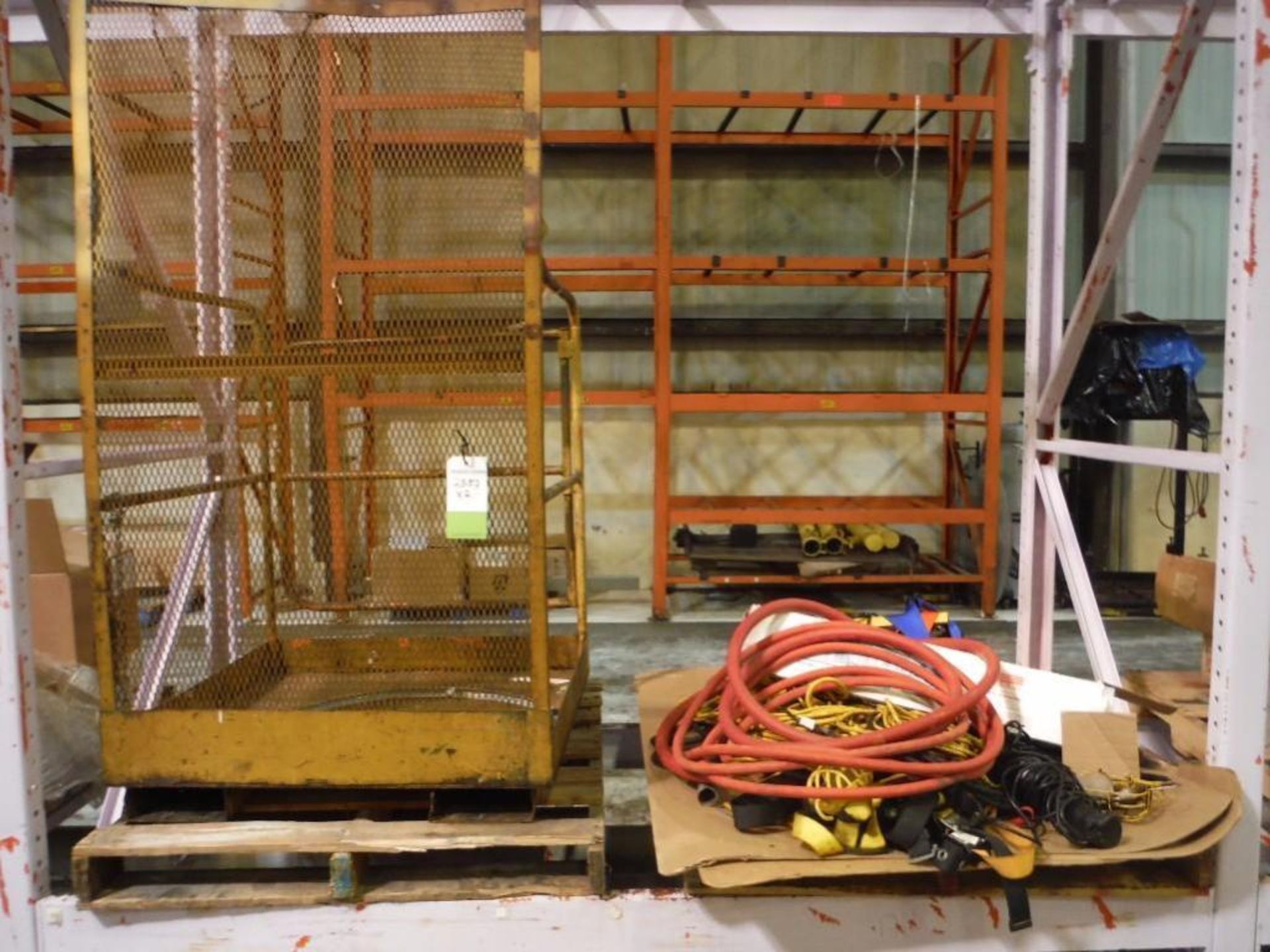 (1) Man Cage and pallet of Miscellaneous extention cords and shop lights  Rigging Fee: $20