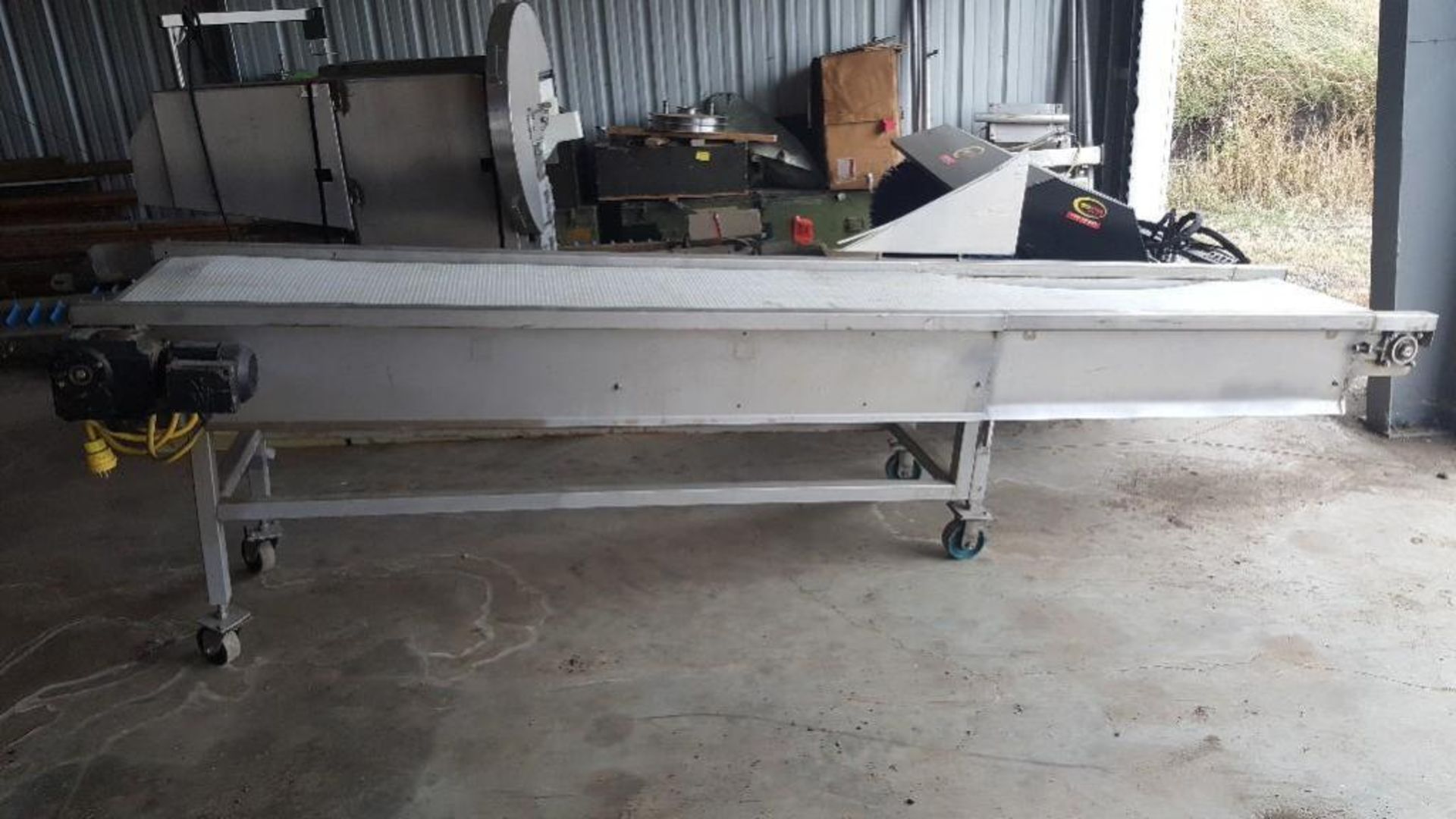 S.S. Incline belt conveyor, white interlock belt, 151 in L x 24 in W x 43 in tall end - 24 in low en