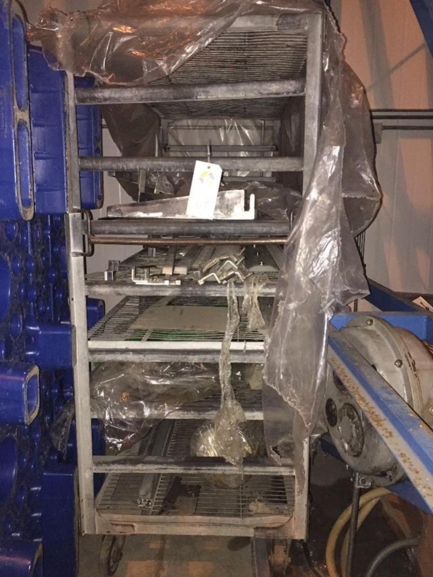 mild steel bakery rack with contents of misc. parts. ** (Located in Fridley, Minnesota) ** Rigging