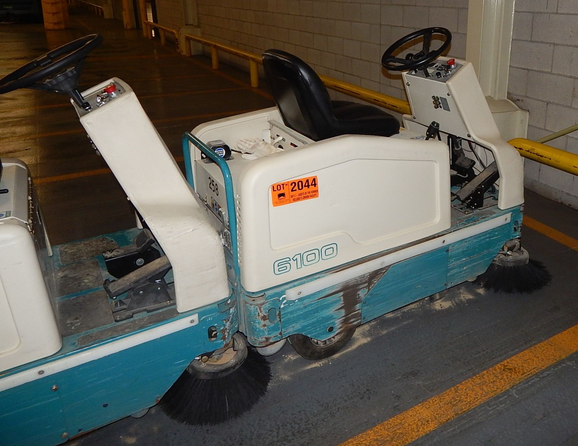 TENANT 6100 ELECTRIC RIDE ON SWEEPER S/N: N/A (WAREHOUSE)