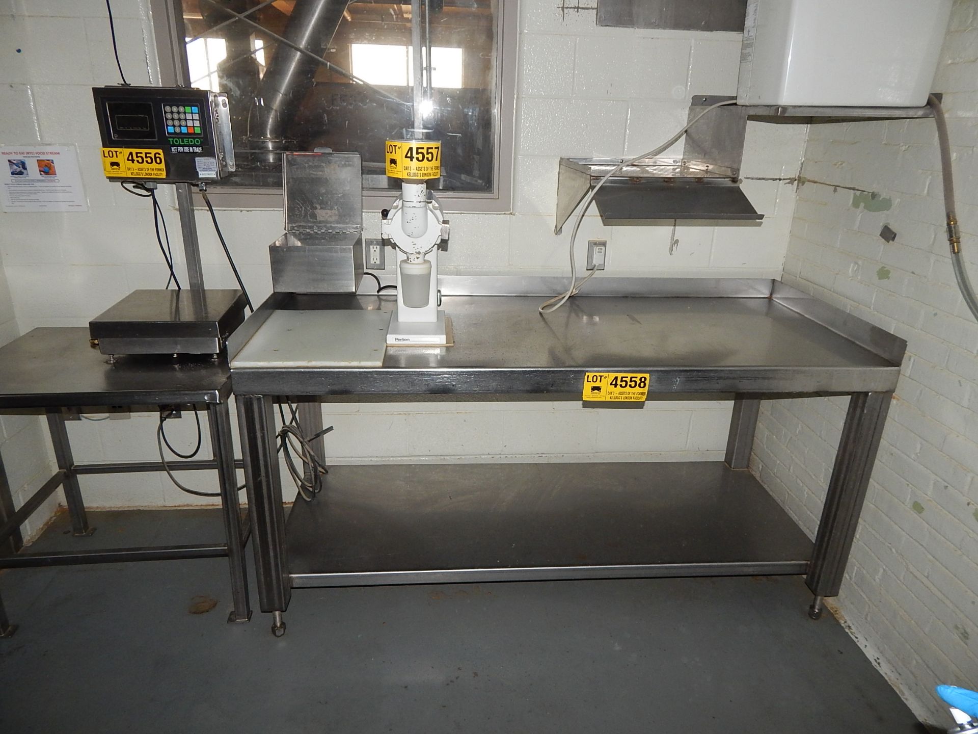 LOT/ STAINLESS STEEL TABLES WITH AIR CONDITIONER AND FLAT SCREEN MONITOR (BUILDING 1A, 3)