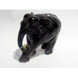 Carved ebony model elephant with inlaid