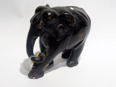 Carved ebony model elephant with inlaid