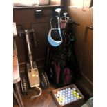 Quantity of various golf clubs and a sho