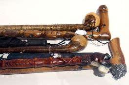 Quantity of carved walking sticks and um