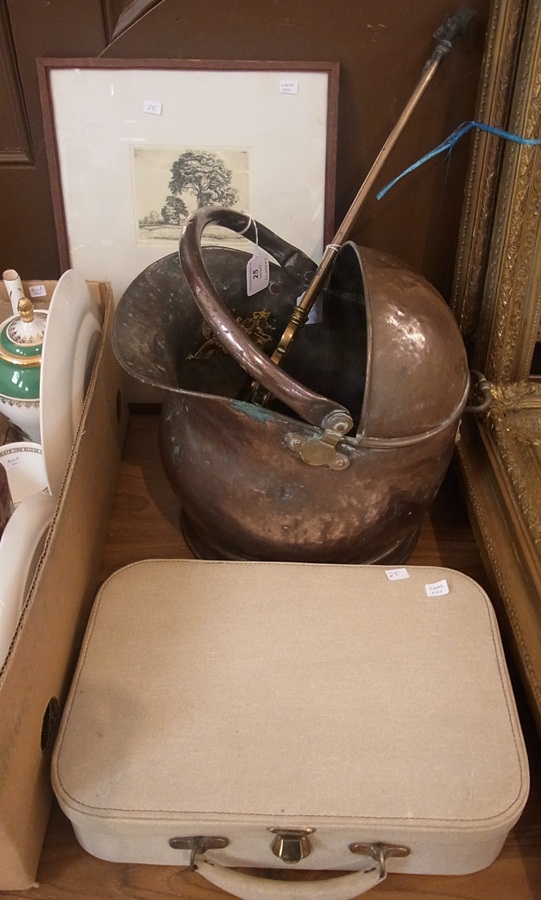 A copper helmet-shaped coal scuttle with