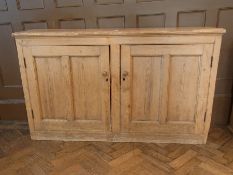 Pine cupboard having single shelf enclos