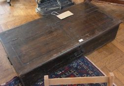 An oak chest with hinged lid, with panel